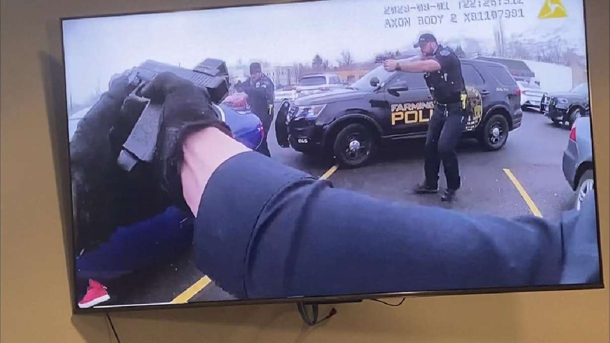 Body-camera videos released Wednesday show Farmington police officers firing about 20 shots at an uncooperative driver as they tried to remove him from his car and spotted a gun.