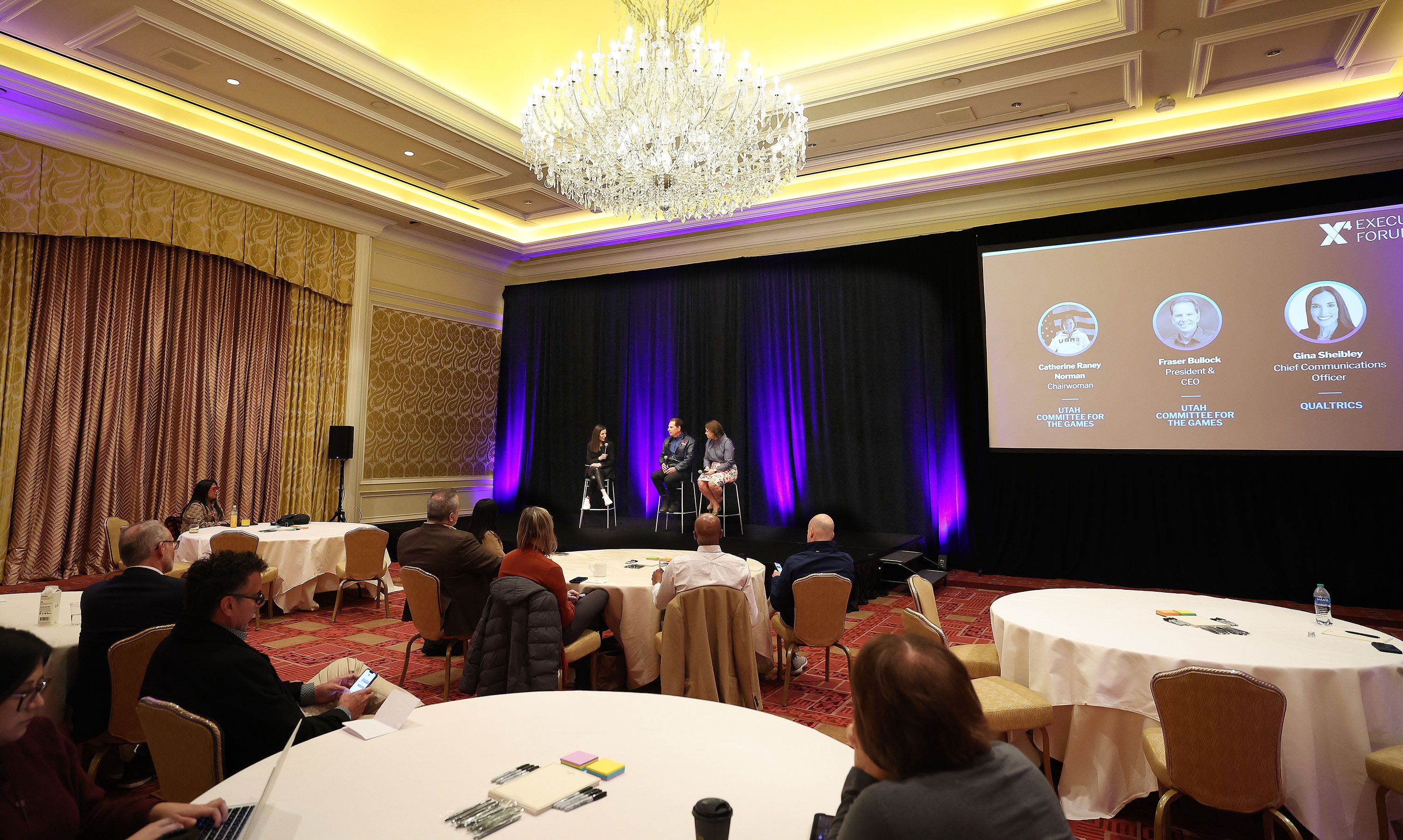 Fraser Bullock and Catherine Rainey Norman, who lead the Salt Lake City-Utah Committee for the Olympic Games, speak in an executive session of the Qualtrics X4: The Experience Management Summit in Salt Lake City on Wednesday.
