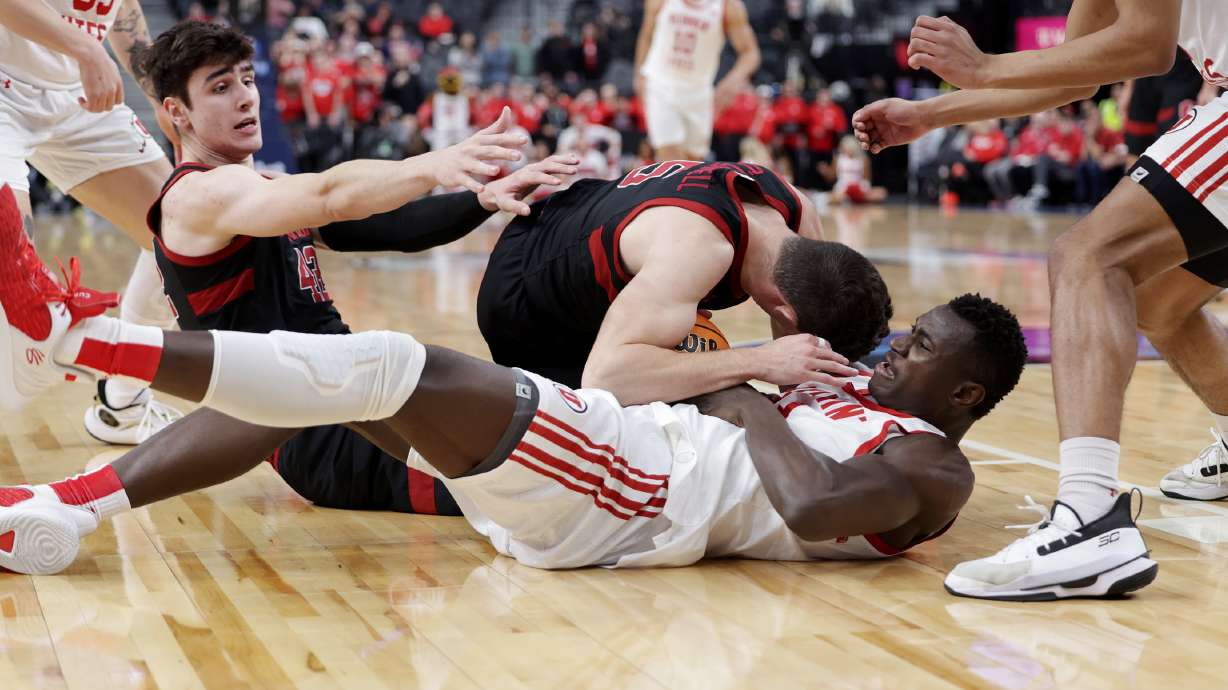 Utah Utes center Keba Keita (13) wrestles with Stanford Cardinal guard Michael O'Connell (5) for the ball as Utah and Stanford play in Pac-12 Tournament action at T-Mobile Arena in Las Vegas on Wednesday, March 8, 2023.