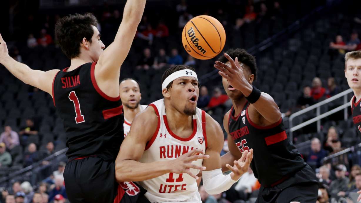 Utah Utes guard Wilguens Exacte Jr. (11) loses the ball as he is defended by Stanford Cardinal guard Isa Silva (1) and Stanford Cardinal forward Harrison Ingram (55) as Utah and Stanford play in Pac-12 Tournament action at T-Mobile Arena in Las Vegas on Wednesday, March 8, 2023.