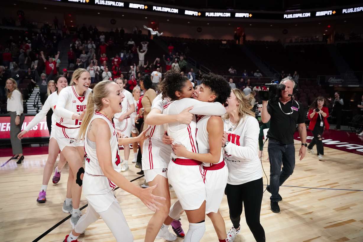 Southern Utah women's basketball celebrates Cherita Daughtery after nailing a 3-pointer buzzer beater to rally the Thunderbirds by New Mexico State, 62-61, in the quarterfinals of the WAC Tournament, Wednesday, March 8, 2023, at Orleans Arena in Las Vegas.