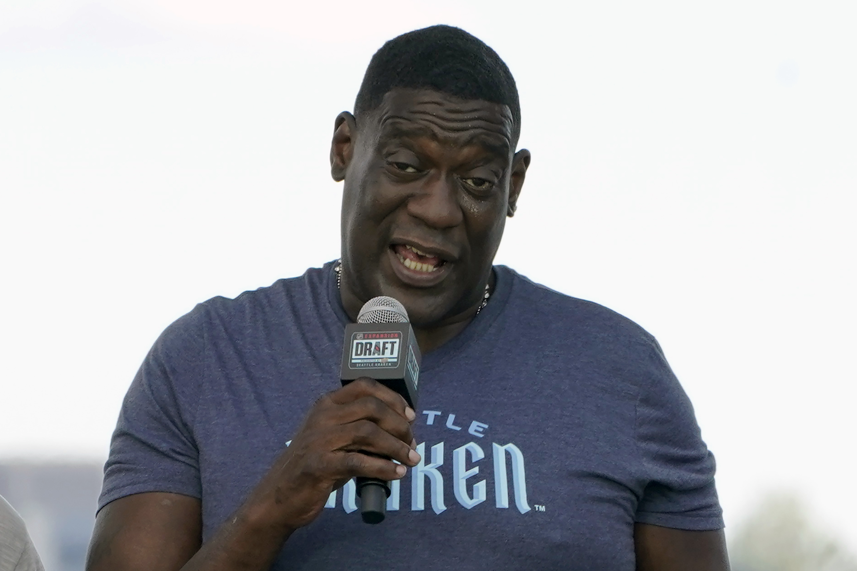 FILE - Former NBA basketball player Shawn Kemp speaks during the Seattle Kraken's NHL hockey expansion draft event in Seattle, July 21, 2021. Shawn Kemp was arrested and charged in connection with a drive-by shooting in Tacoma, Washington, a Pierce County sheriff's official said Thursday, March 9, 2023. Online jail records show Kemp was booked on a felony charge of drive-by shooting. Sheriff spokesman Darren Moss said Kemp, 53, was scheduled to appear in court Thursday afternoon. 