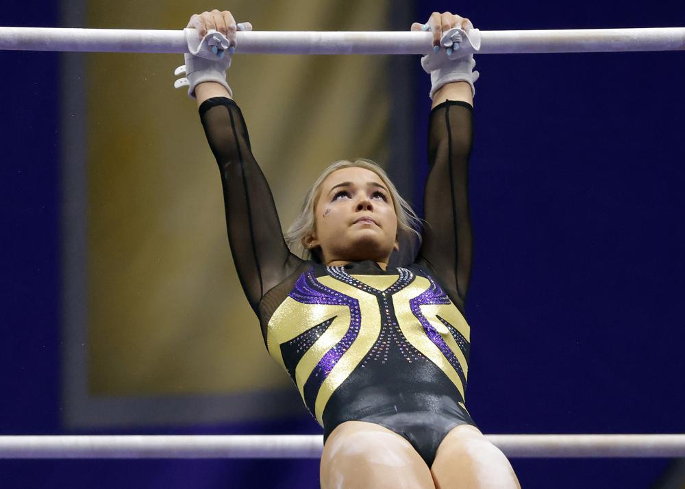 LSU gymnast Olivia Dunne competes during an NCAA gymnastics meet against Arkansas on Jan. 8, 2021 in Baton Rouge, La. LSU gymnast Olivia Dunne's endorsement of an artificial intelligence essay-writing product is raising questions.