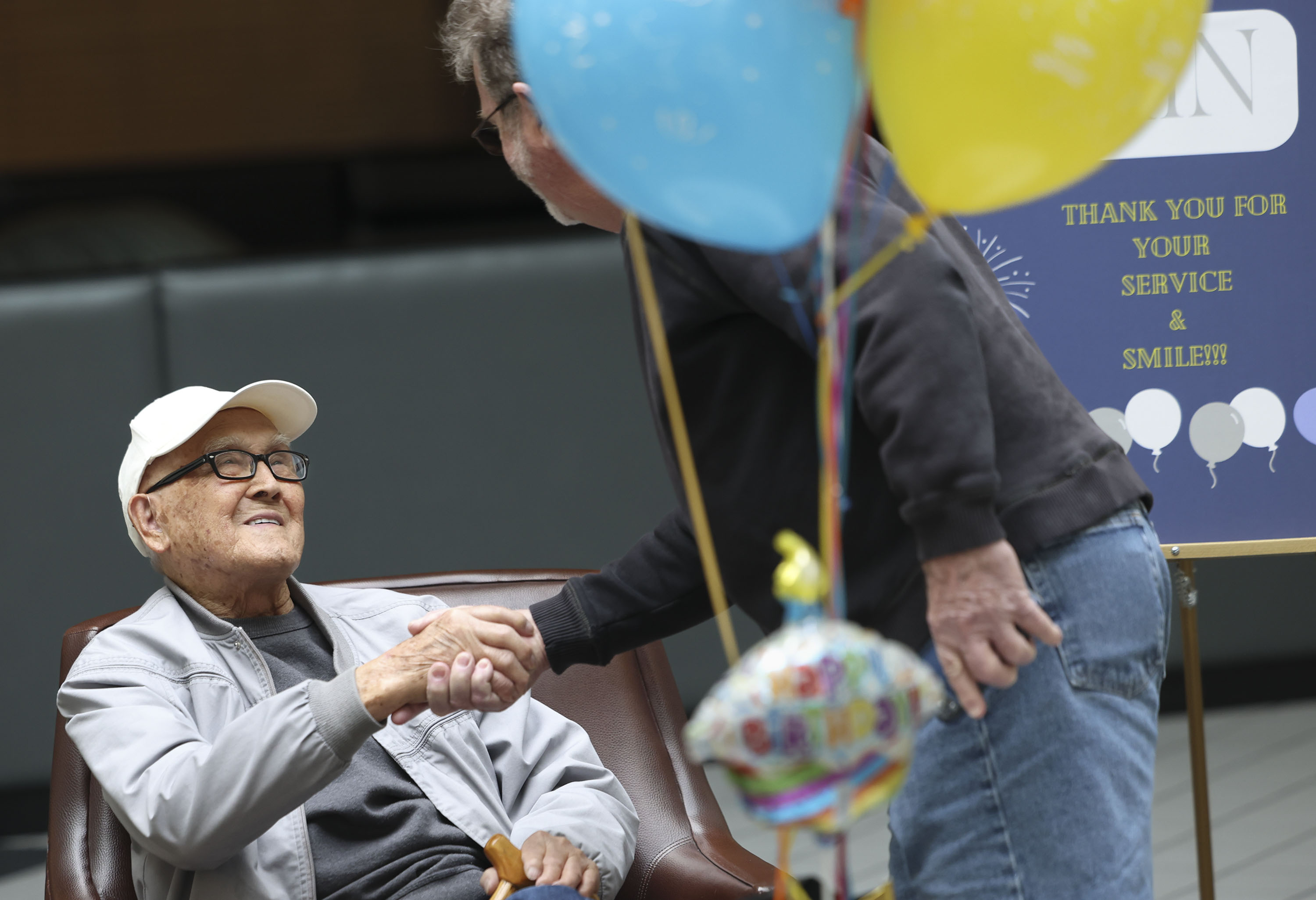 Minoru Hamada is thanked for his service during his birthday party at the Newgate Mall in Ogden on Thursday. The mall walkers gathered for Hamada who turns 100 years old on Friday. Hamada volunteered for the military and joined other Japanese Americans to
serve as members of the 442nd Regimental Combat Team during World War II.