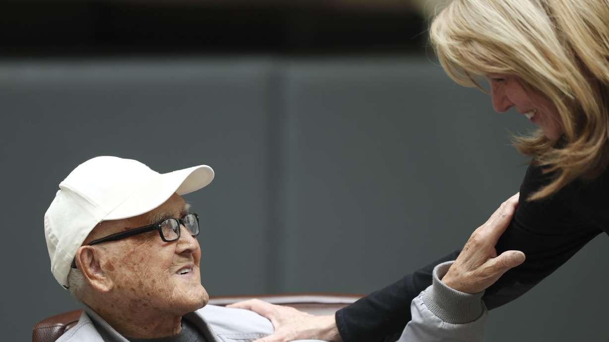 Minoru Hamada thanks Kathleen Hurst for arranging a party to celebrate his 100th birthday at the Newgate Mall in Ogden on Thursday. Hamada turns 100 on Friday.