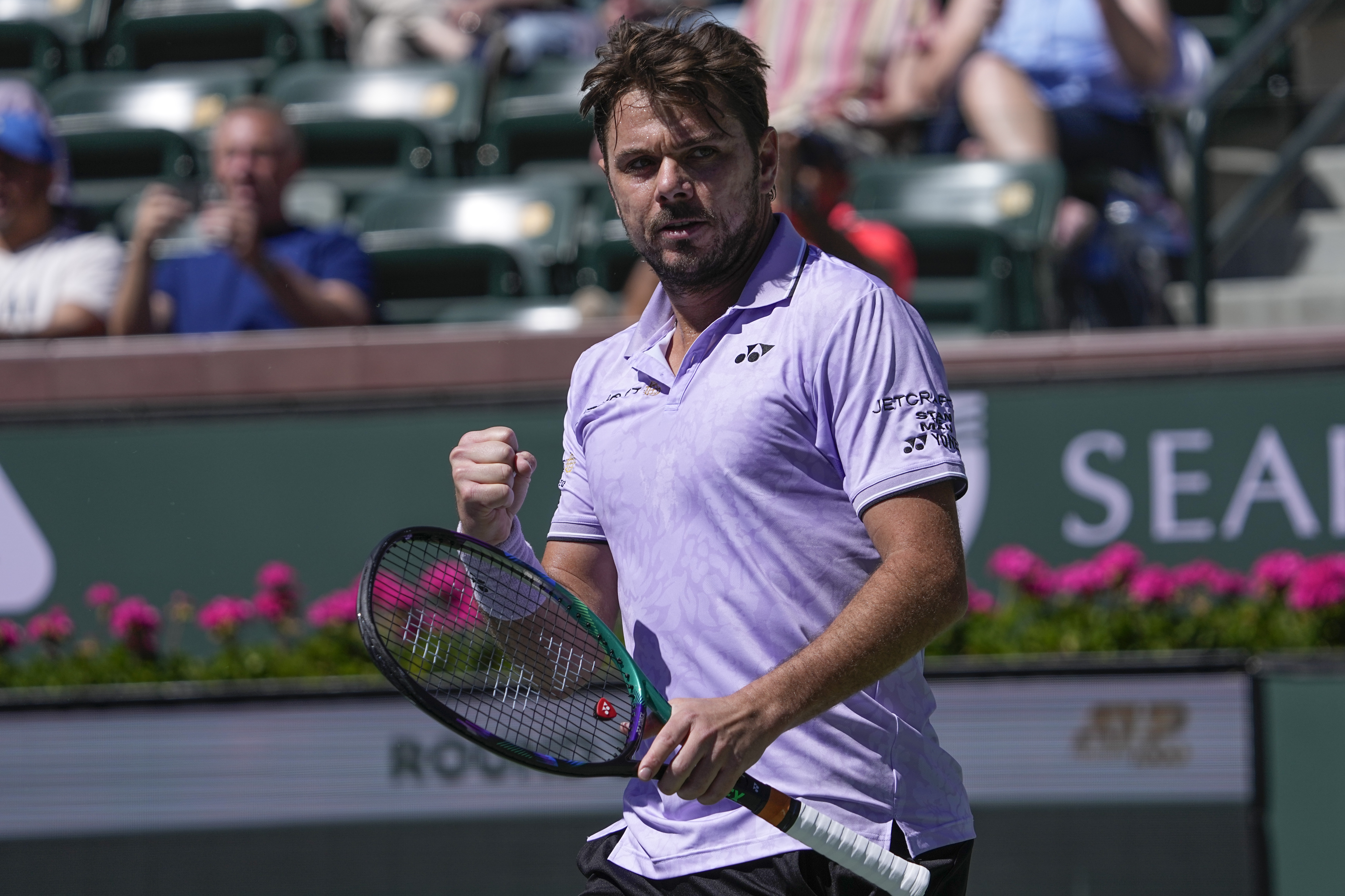 Stan Wawrinka, of Switzerland, reacts after scoring a point against Aleksandar Vukic, of Australia, at the BNP Paribas Open tennis tournament Thursday, March 9, 2023, in Indian Wells, Calif. 