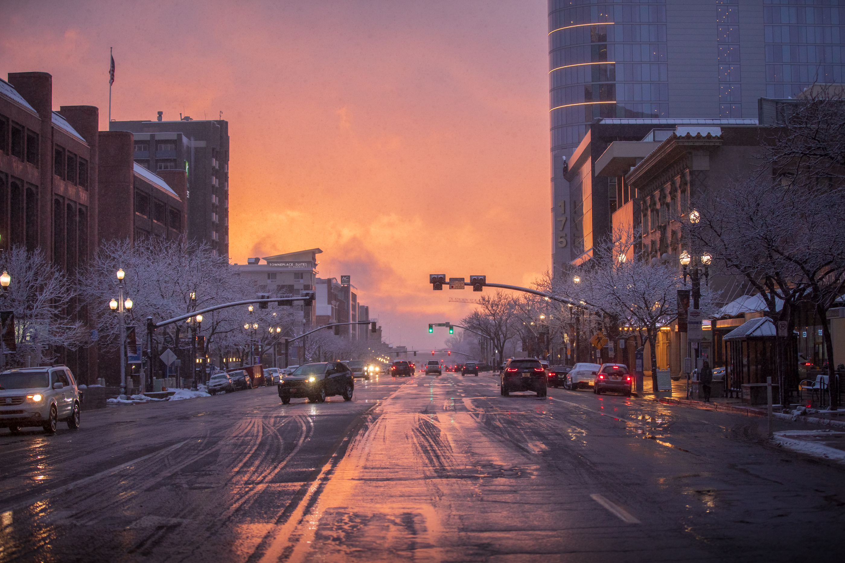 Vehicles travel on 200 South in downtown Salt Lake City after snow flurries on Wednesday. Another storm is expected to provide valley rain and mountain snow across Utah primarily on Friday.