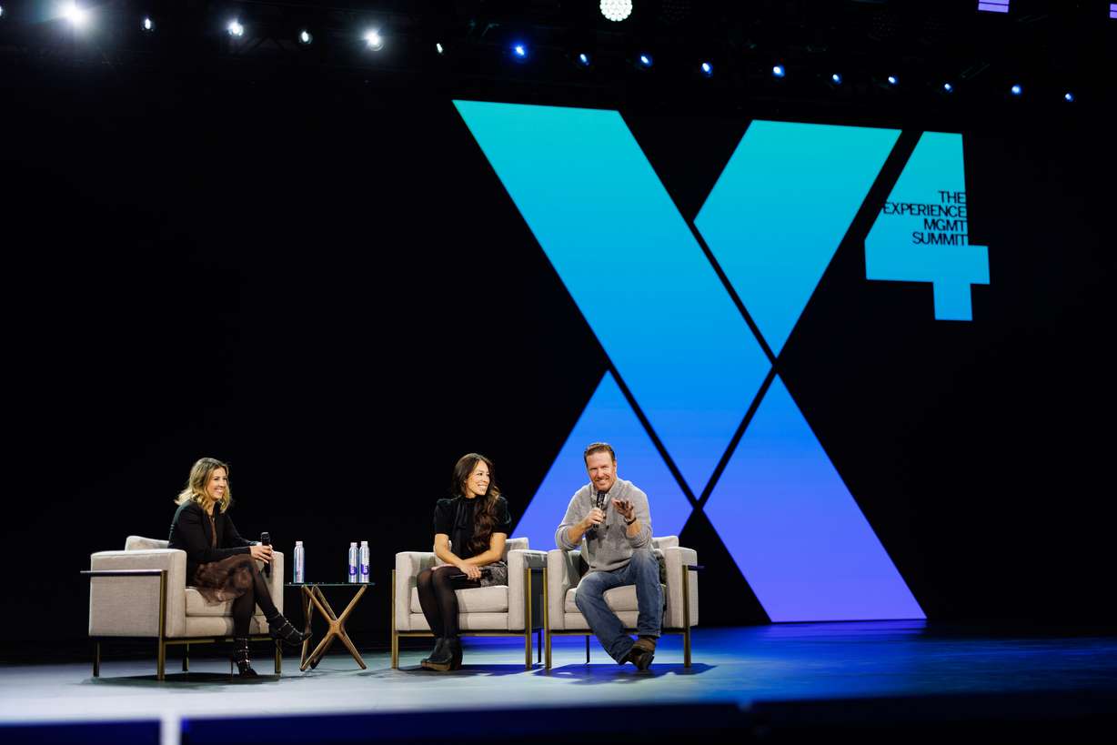 Chip and Joanna Gaines speak during Day Two of Qualtrics X4: The Experience Management Summit at the Salt Palace in Salt Lake City on Thursday.