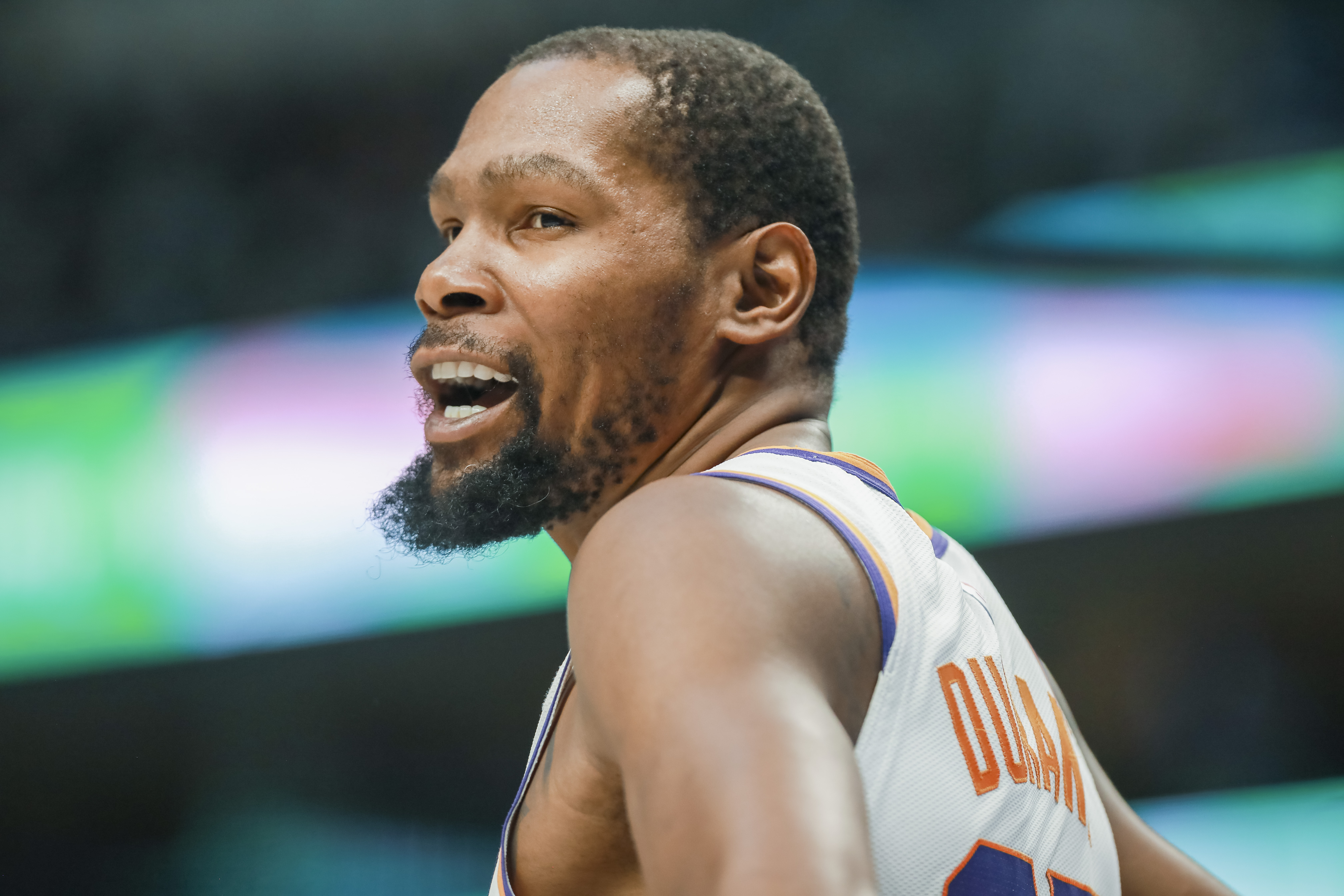 Phoenix Suns forward Kevin Durant interacts with a fan during the first half of an NBA basketball game against the Dallas Mavericks, Sunday, March 5, 2023, in Dallas. 