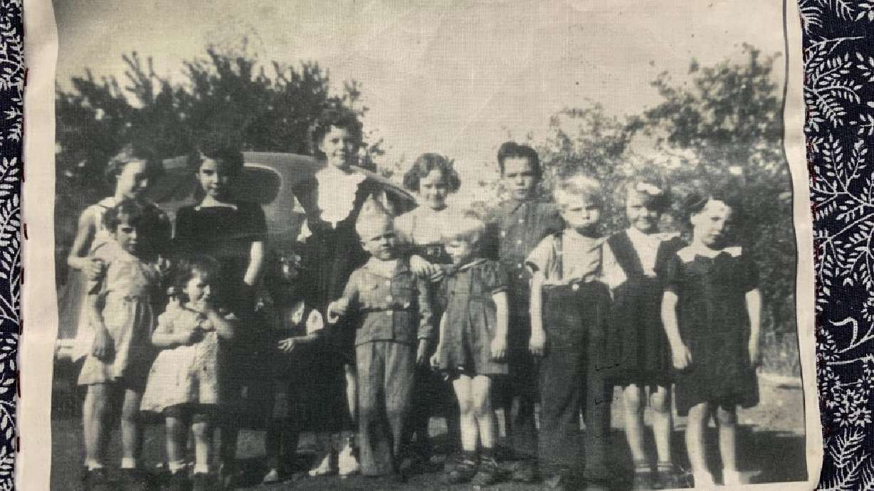 The Hurricane Family History Center hopes to reunite this homemade quilt which features photos with its family in Hurricane. The quilt was found in a storage unit.