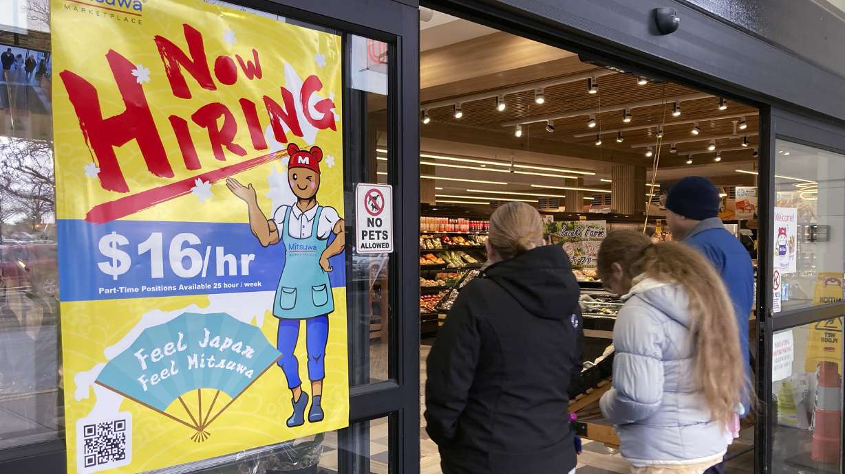A hiring sign is displayed in Arlington Heights, Ill., Jan. 13. U.S. employers added a substantial 311,000 jobs in February, the government said Friday.
