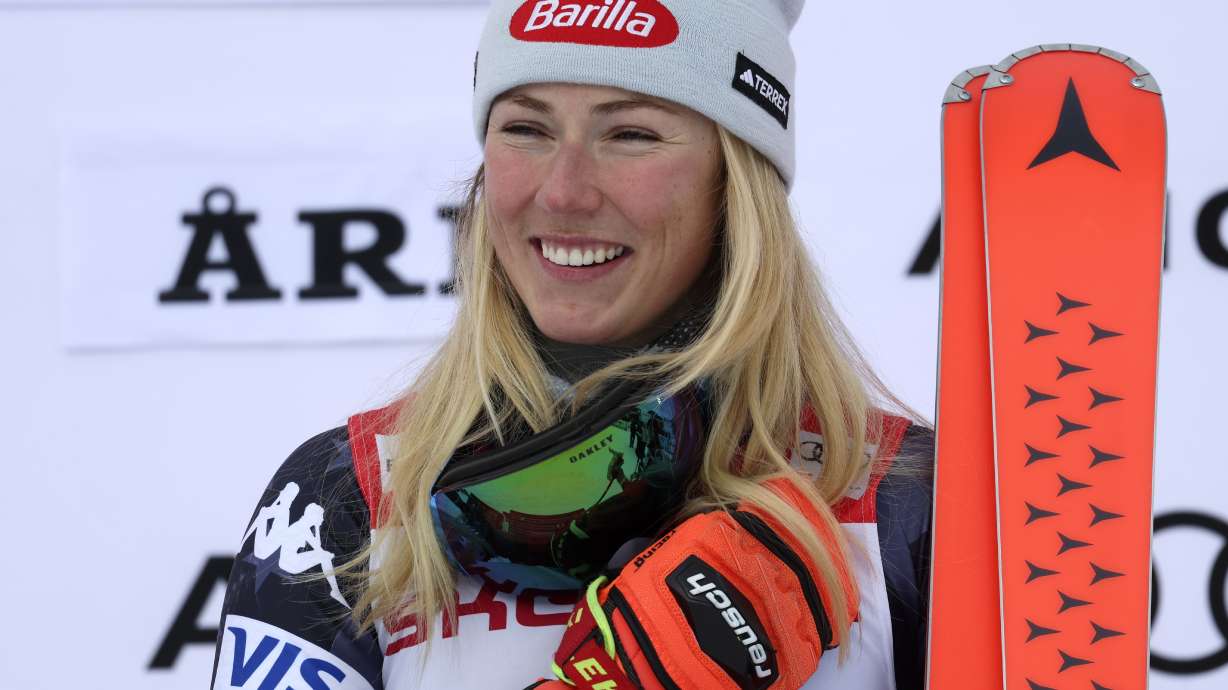 United States' Mikaela Shiffrin celebrates on the podium after winning an alpine ski, women's World Cup giant slalom race, in Are, Sweden, Friday, March 10, 2023. Shiffrin has won her record-tying 86th World Cup race with victory in a giant slalom, matched the overall record set by Swedish great Ingemar Stenmark 34 years ago.