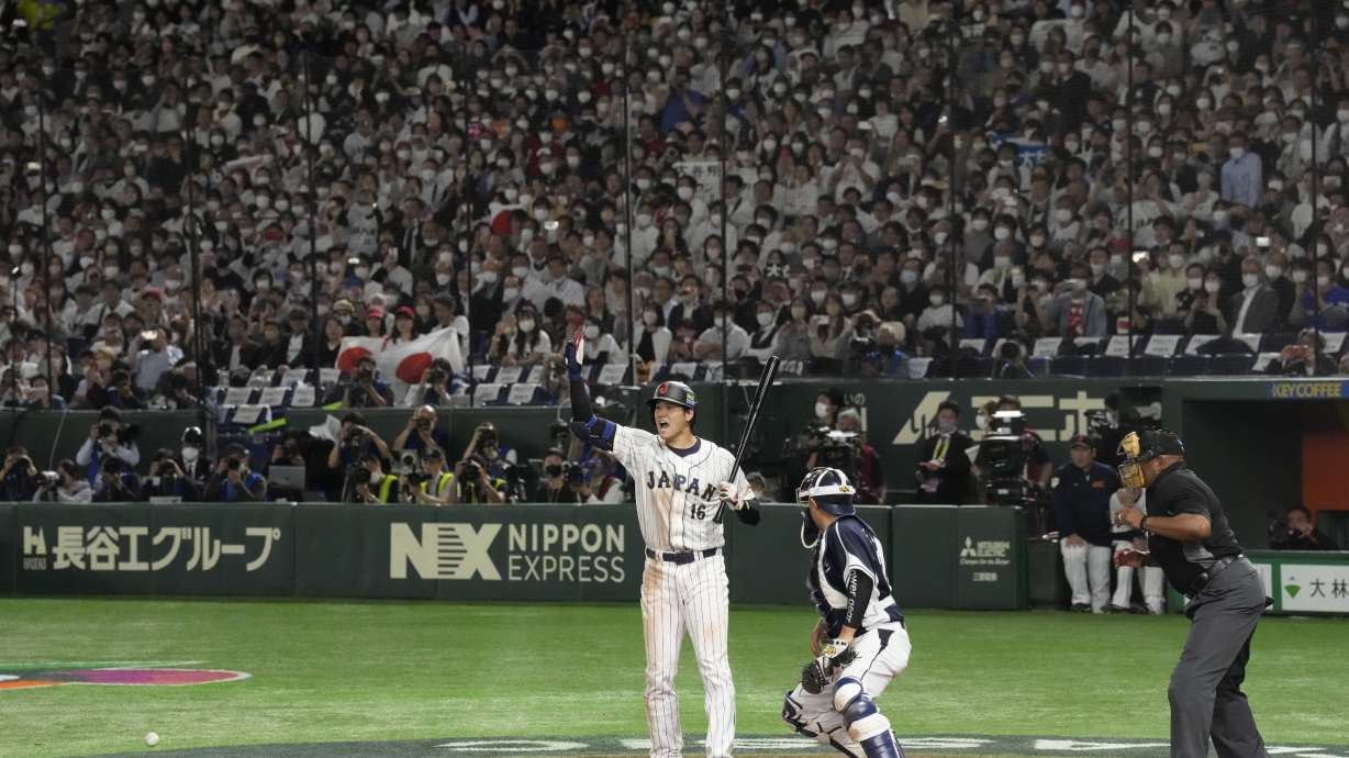 Shohei Ohtani of Japan gestures to Takumu Nakano from a wild pitch by South Korea's pitcher Lee Eui-lee during the seventh inning of the first round Pool B game between South Korea and Japan at the World Baseball Classic (WBC) at Tokyo Dome in Tokyo, Japan, Friday, March 10, 2023.