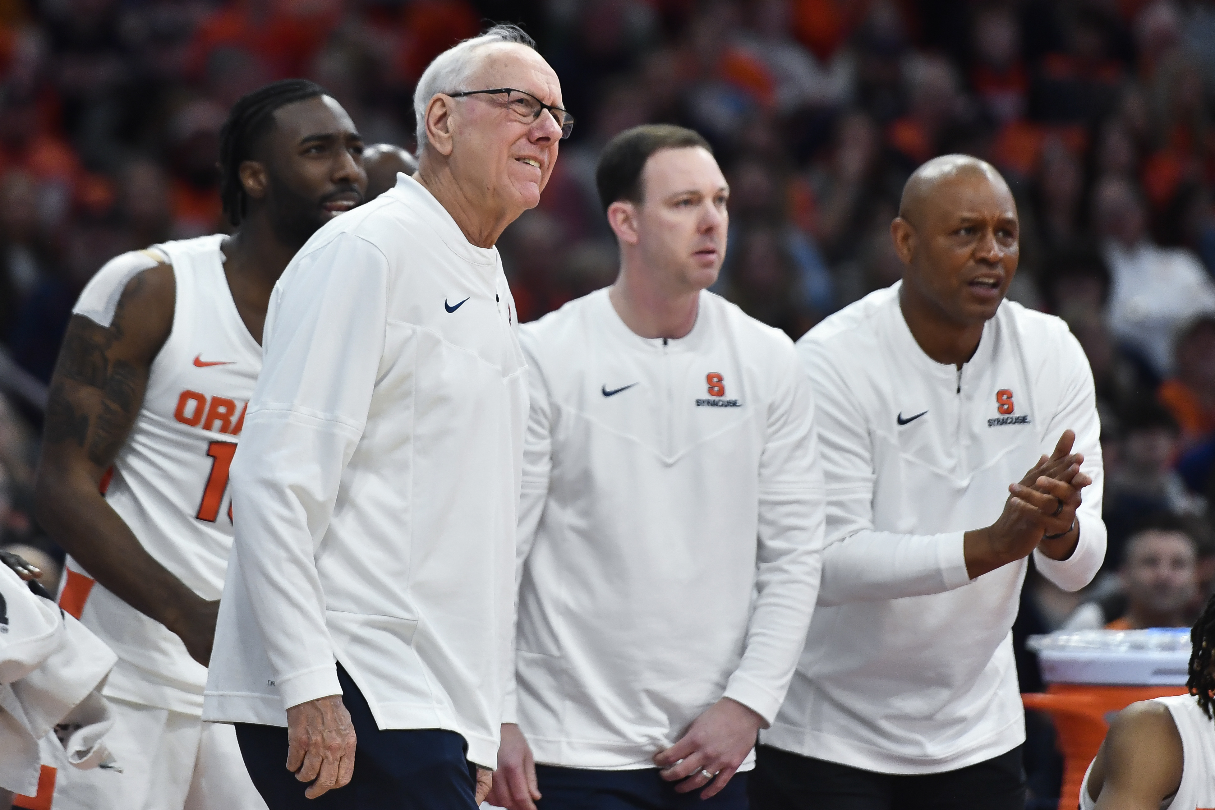 FILE -Syracuse head coach Jim Boeheim, left, assistant coach Gerry McNamara, center, and associate head coach Adrian Autry watch from the sideline during the second half of an NCAA college basketball game against Boston College in Syracuse, N.Y., Saturday, Dec. 31, 2022. Syracuse coach Jim Boeheim is retiring after 47 years of leading the university's basketball program, the team announced Wednesday, March 8, 2023 after a loss knocked them out of the ACC Conference Tournament. 