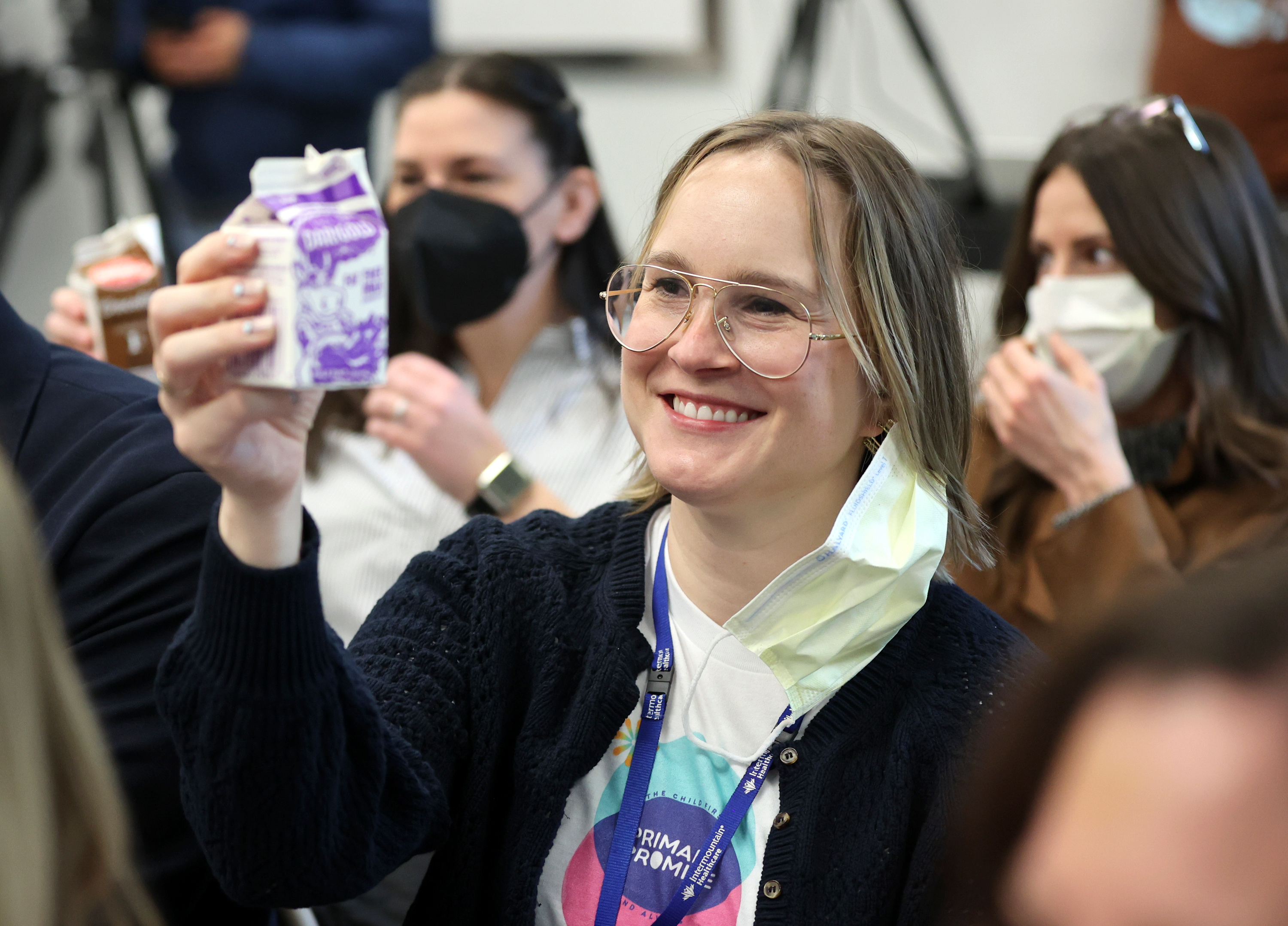 Stephanie Sokolowski, Intermountain Foundation director of corporate and foundation relations, and others raise cartons of milk in a toast to the new Primary Pantry at Primary Children’s Hospital Friday. 