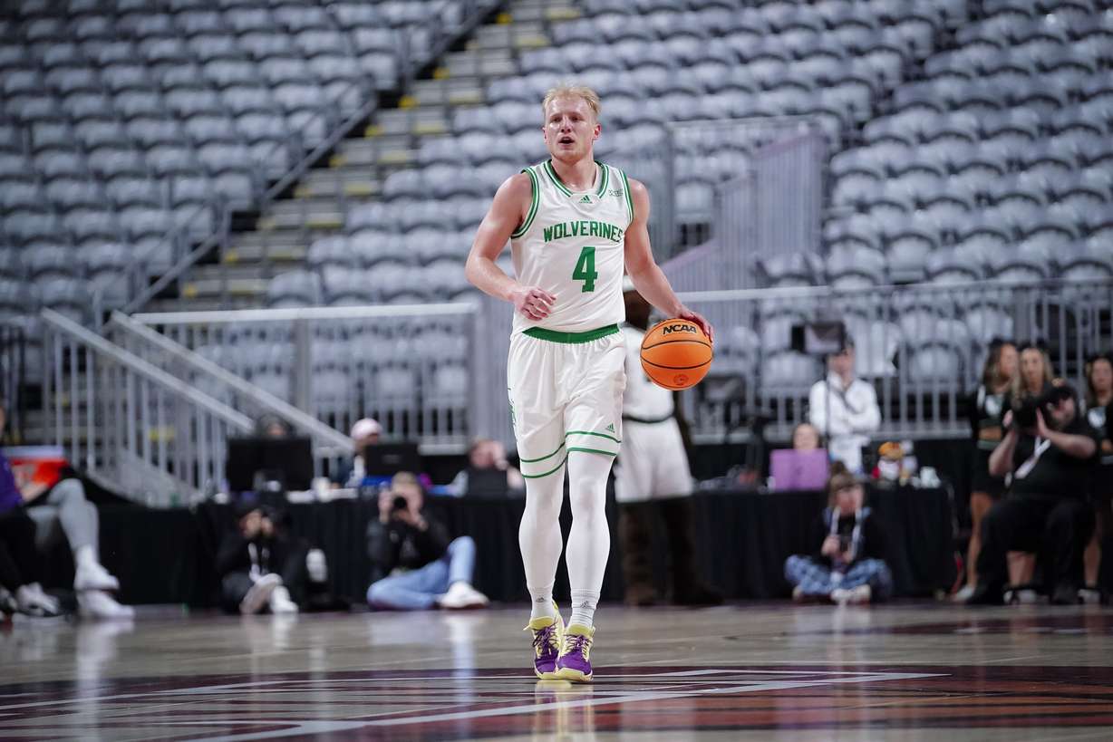 Utah Valley guard Trey Woodbury dribbles the ball in the first half of a WAC Tournament semifinal against Southern Utah, Friday, March 10, 2023 at Orleans Arena in Las Vegas.