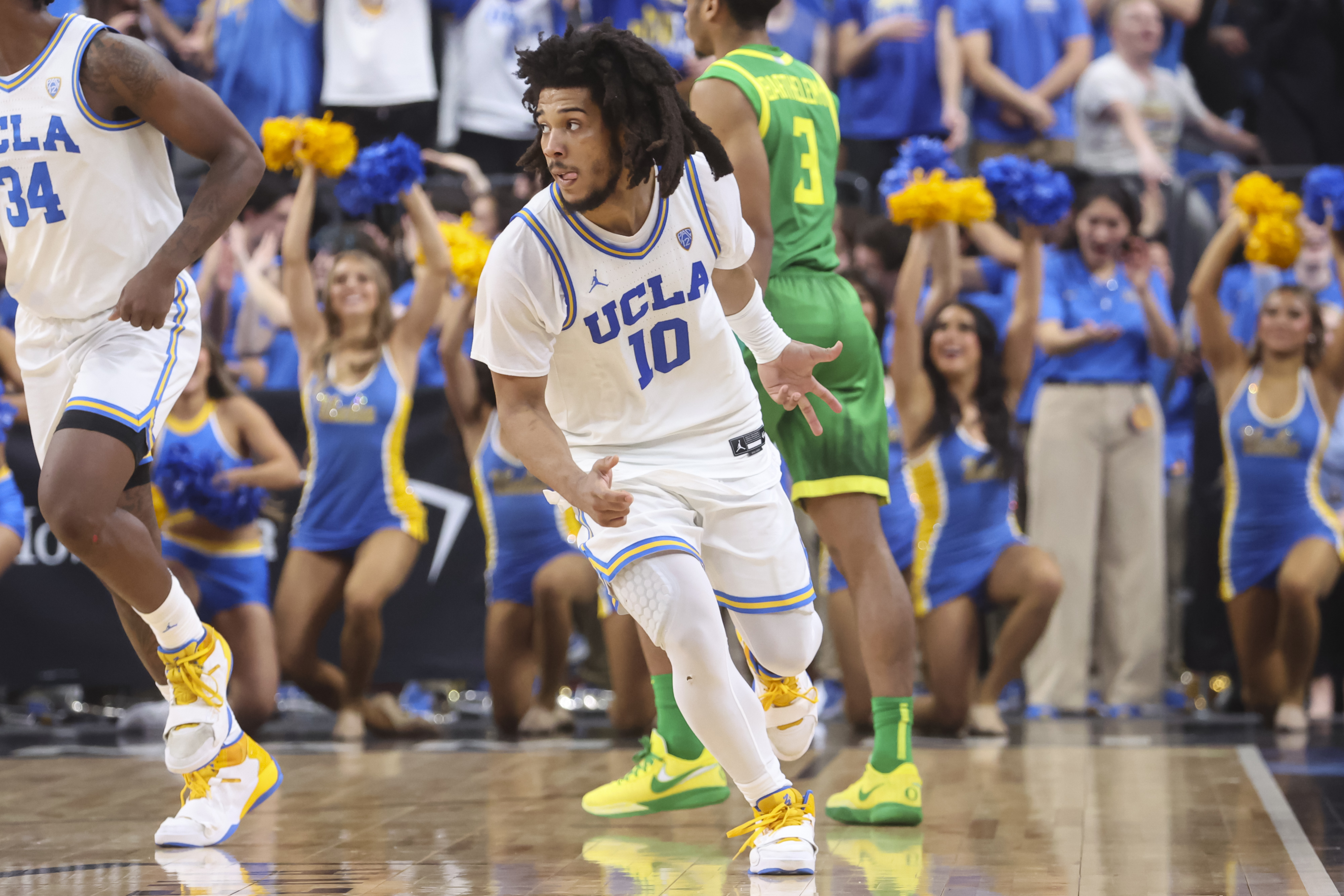 UCLA guard Tyger Campbell (10) reacts after scoring a three-point basket against Oregon during the second half of an NCAA college basketball game in the quarterfinals of the Pac-12 Tournament, Friday, March 10, 2023, in Las Vegas. 