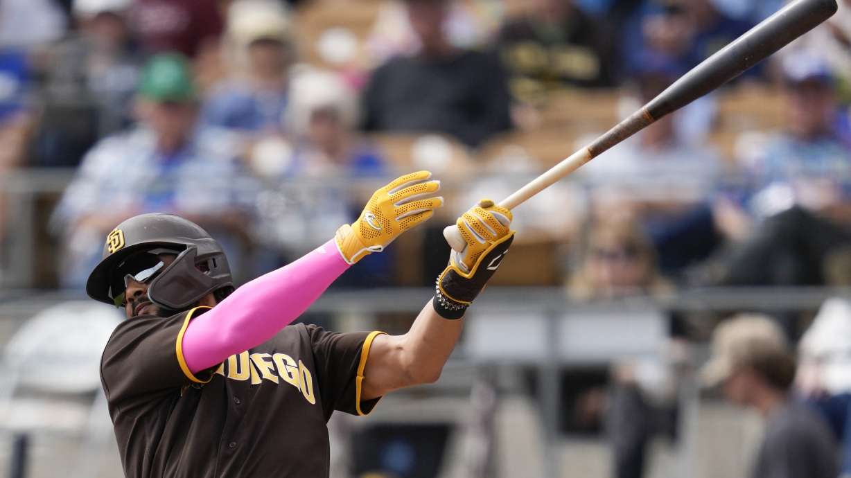 San Diego Padres' Fernando Tatis Jr. (23) pops out to second base during the first inning of a spring training baseball game against the Los Angeles Dodgers in Glendale, Calif., Monday, March 6, 2023.