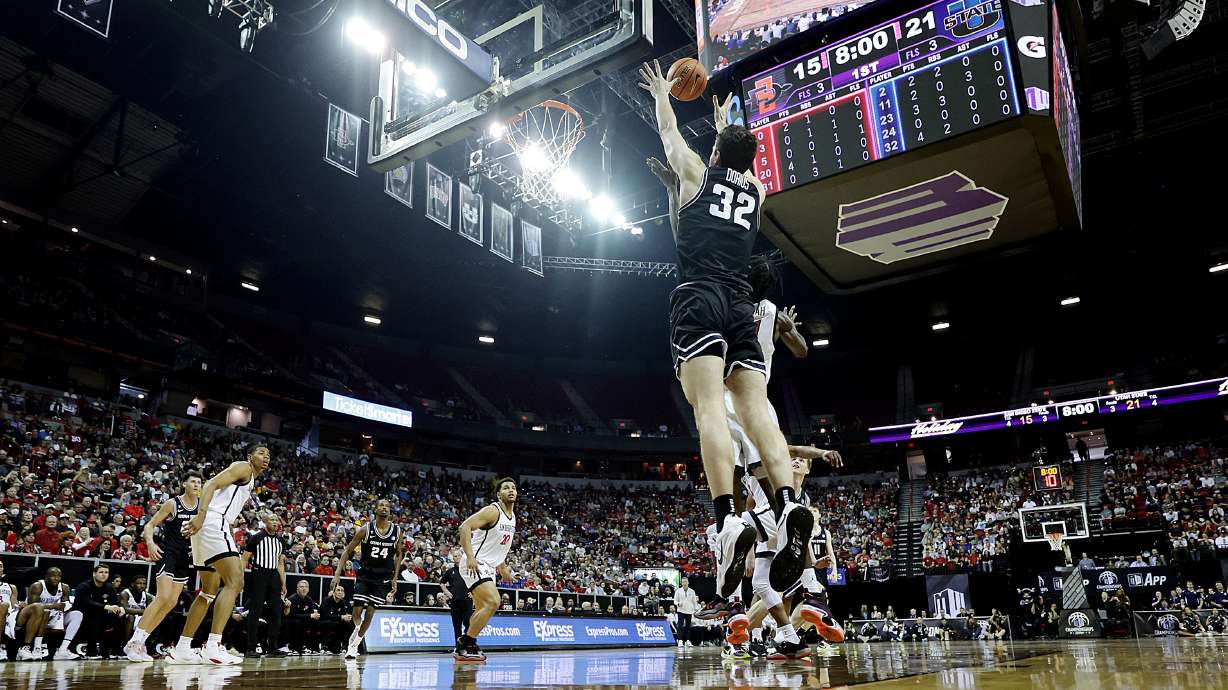 Utah State Aggies center Trevin Dorius (32) catches high pass at the hoop as Utah State and San Diego State play in the Mountain West Conference Basketball Tournament Championship at UNLV’s Thomas and Mack Center in Las Vegas on Saturday, March 11, 2023.