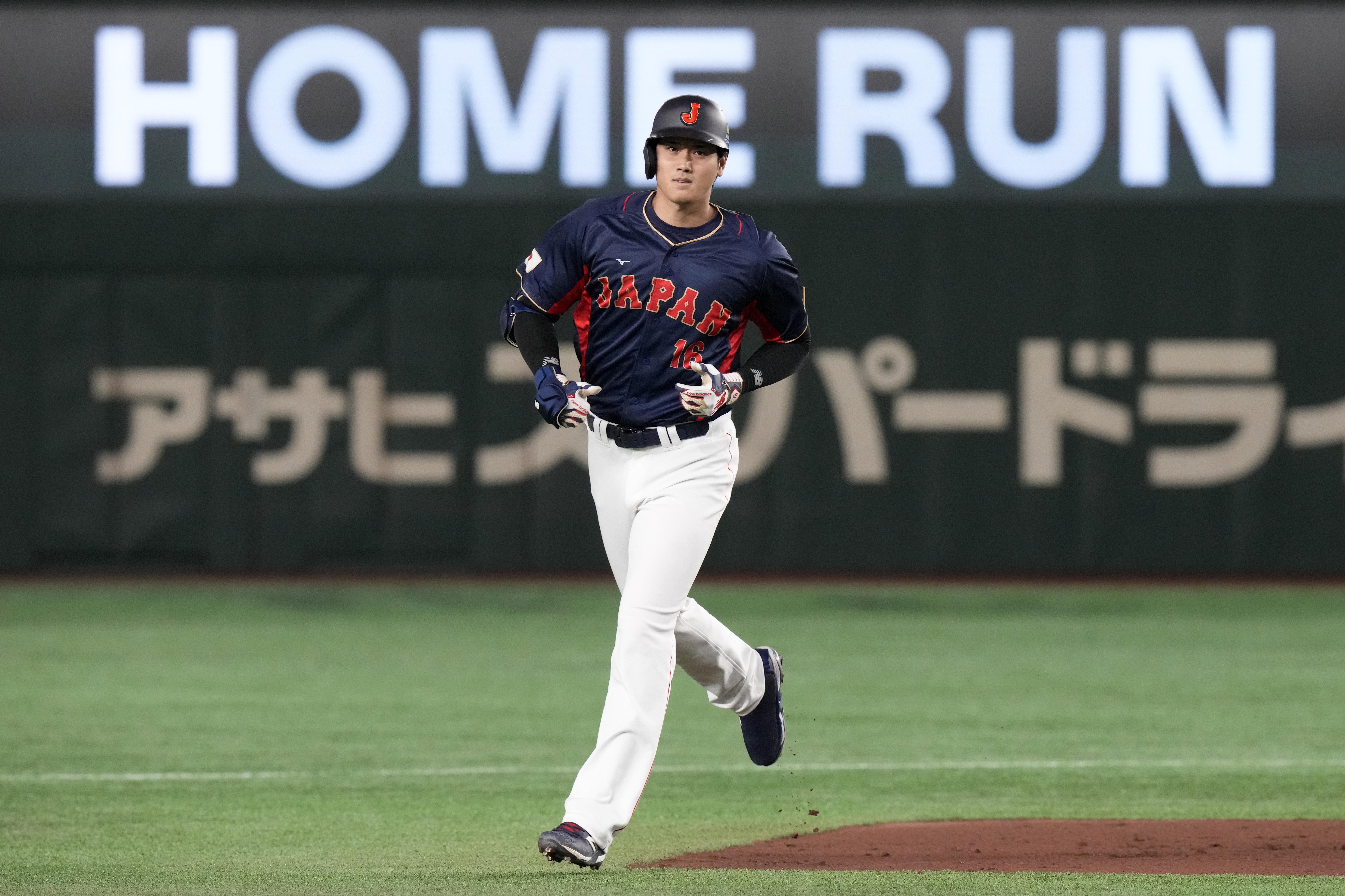 Shohei Ohtani of Japan rounds the bases after hitting a 3-run home run in the 1rst inning against Australia during their Pool B game at the World Baseball Classic at the Tokyo Dome Sunday, March 12, 2023, in Tokyo. 