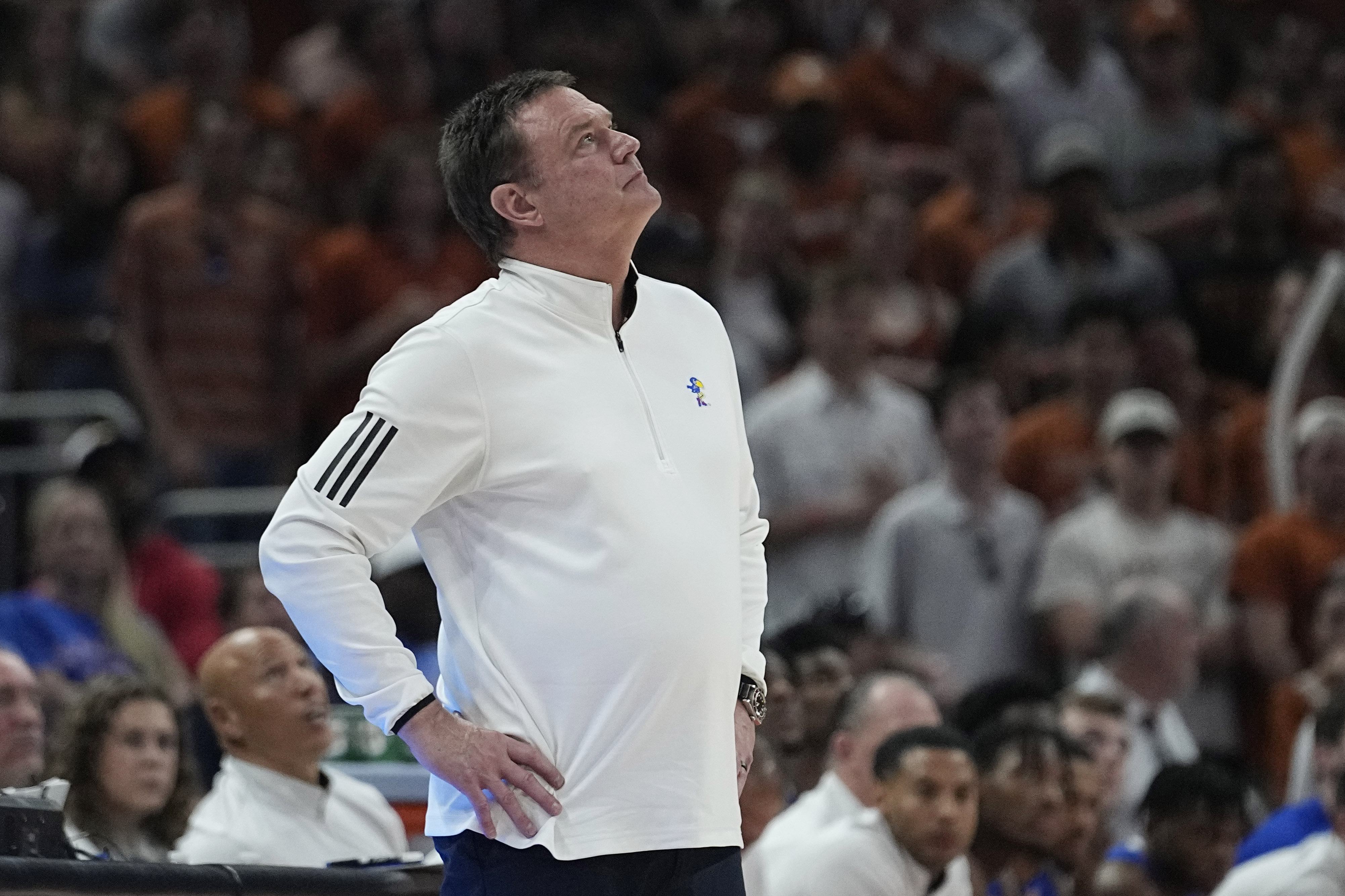 Kansas head coach Bill Self watches a replay during the second half of an NCAA college basketball game against Texas in Austin, Texas, Saturday, March 4, 2023. 