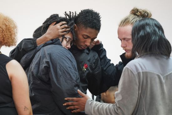People comfort each other after a vigil for a group of Americans recently kidnapped in Mexico, at Word of God Ministries in Scranton, South Carolina March 8. Two of the four Americans, all from South Carolina, were killed after being caught in a deadly shootout while traveling last week to Matamoros for one of them to get cosmetic surgery.