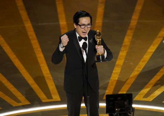 Ke Huy Quan accepts the award for best performance by an actor in a supporting role for "Everything Everywhere All at Once" at the Oscars on Sunday at the Dolby Theatre in Los Angeles.