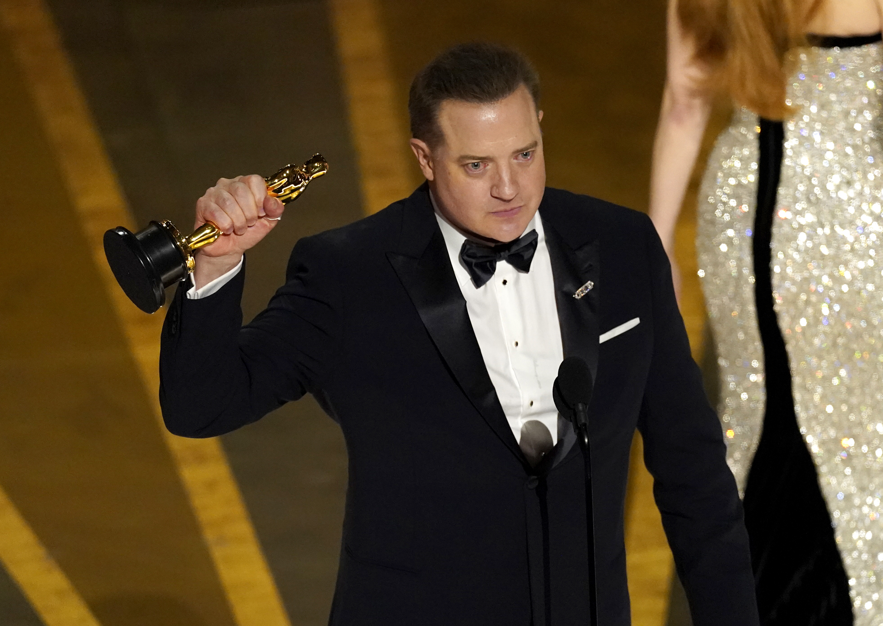 Brendan Fraser accepts the award for best performance by an actor in a leading role for "The Whale" at the Oscars on Sunday at the Dolby Theatre in Los Angeles.