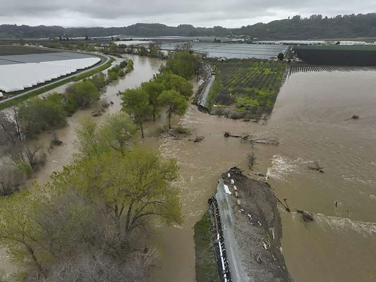 Aerial view of a broken levee and flooded river in Pajaro, California, Sunday. Another atmospheric river is expected to bring more rain to areas of California Monday.