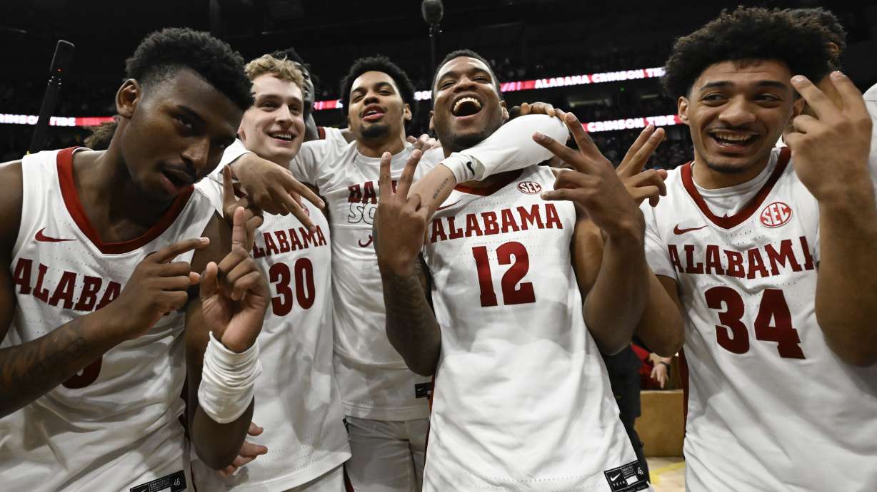 Alabama players celebrate on the court after an NCAA college basketball game against Texas A&M in the finals of the Southeastern Conference Tournament, Sunday, March 12, 2023, in Nashville, Tenn.