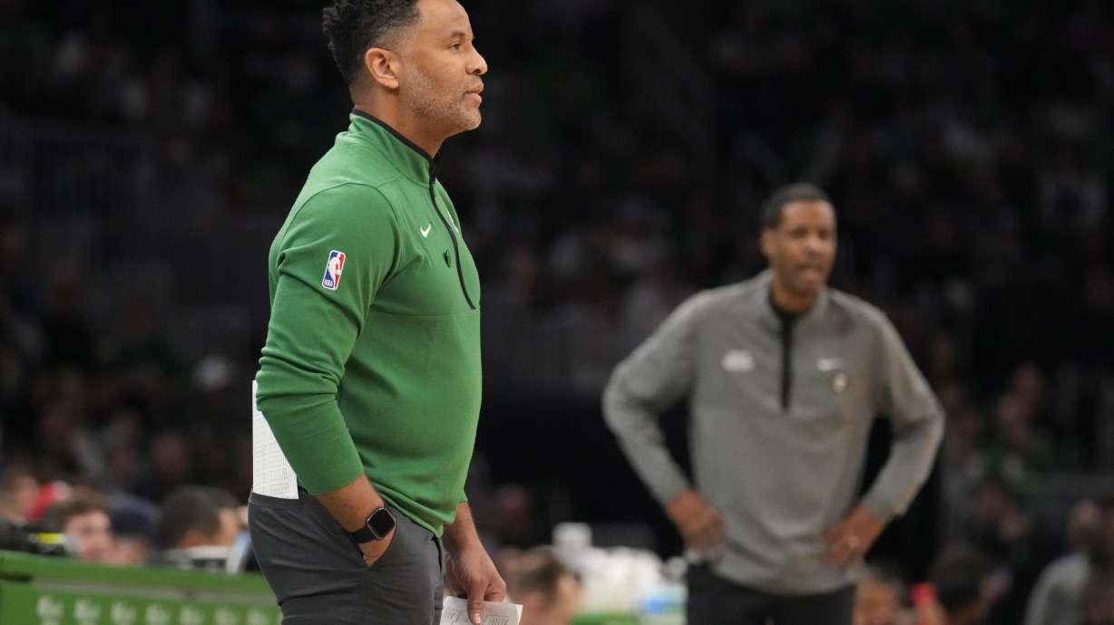 FILE - Boston Celtics assistant coach Damon Stoudamire, filling in for interim head coach Joe Mazzulla, draws up a play during a time out in the first half of an NBA basketball game against the Houston Rockets on Dec. 27, 2022, in Boston. Stoudamire was hired Monday, March 13, 2023, as Georgia Tech's men's basketball coach.