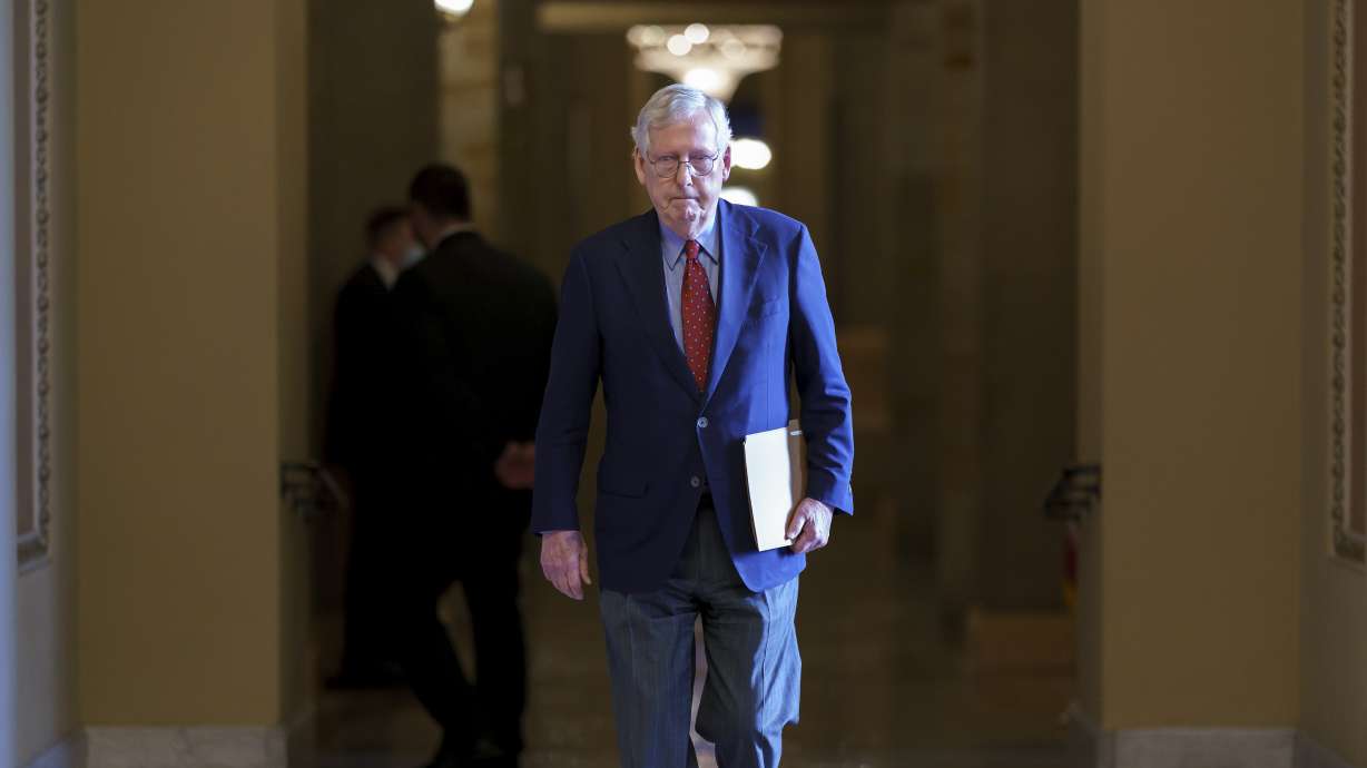 Senate Minority Leader Mitch McConnell, R-Ky., walks to the chamber for a test vote on a government spending bill, at the Capitol in Washington, Sept. 27, 2021. McConnell has been released from the hospital after treatment for a concussion.
