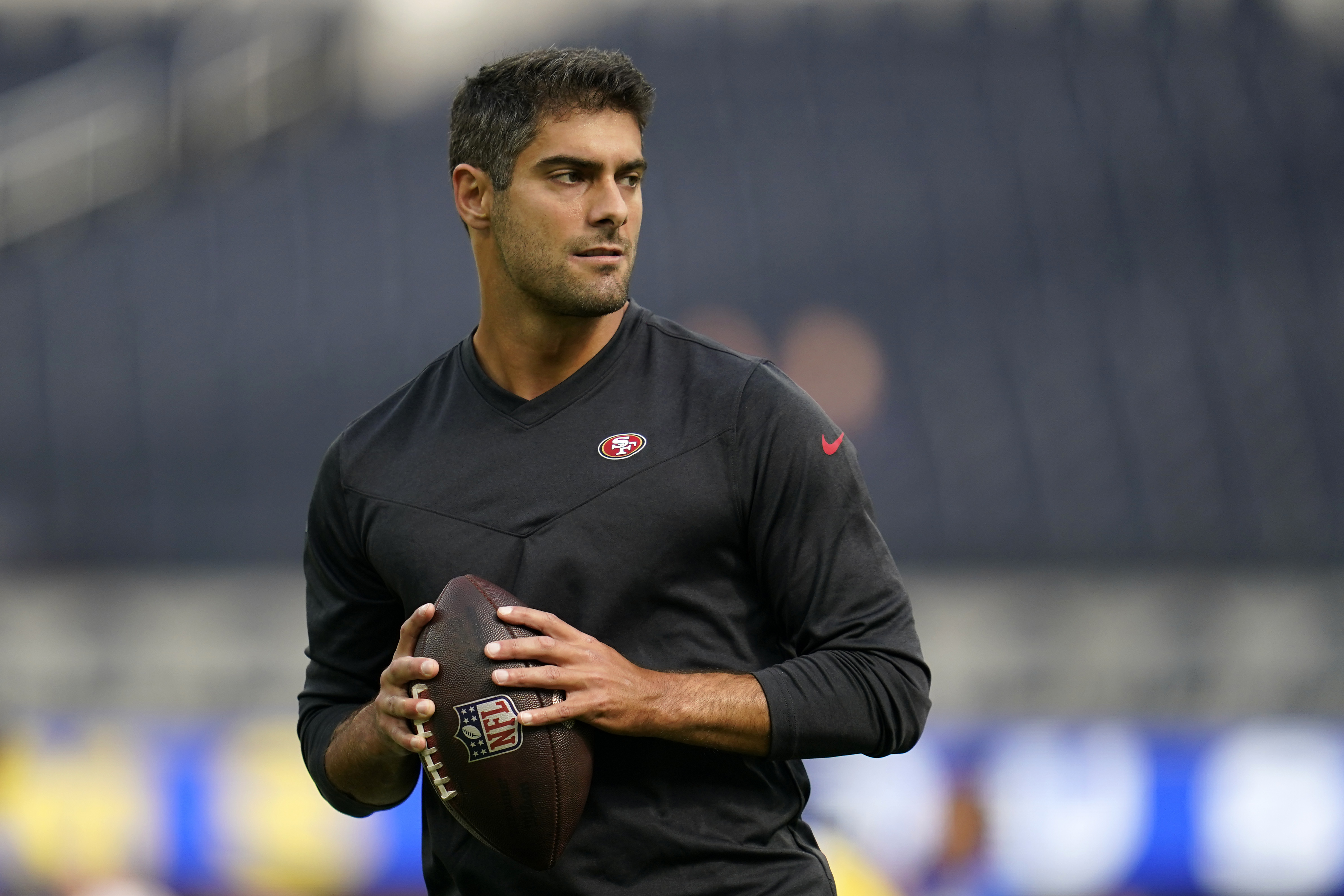 FILE - San Francisco 49ers quarterback Jimmy Garoppolo warms up prior to an NFL football game against the Los Angeles Rams on Oct. 30, 2022, in Inglewood, Calif. Garoppolo has agreed to a three-year, $67.5 million contract with the Las Vegas Raiders, according to a person with knowledge of the deal. The person spoke on condition of anonymity because the deal can’t be announced until Wednesday, March 15, 2023. 