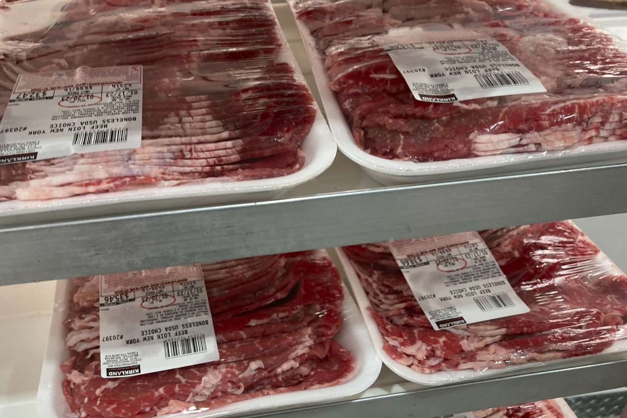 Packages of beef are prepared for display at a food store, Jan. 17, in North Miami, Fla. On Tuesday, the Labor Department reports U.S. consumer price increases eased slightly from January to February.