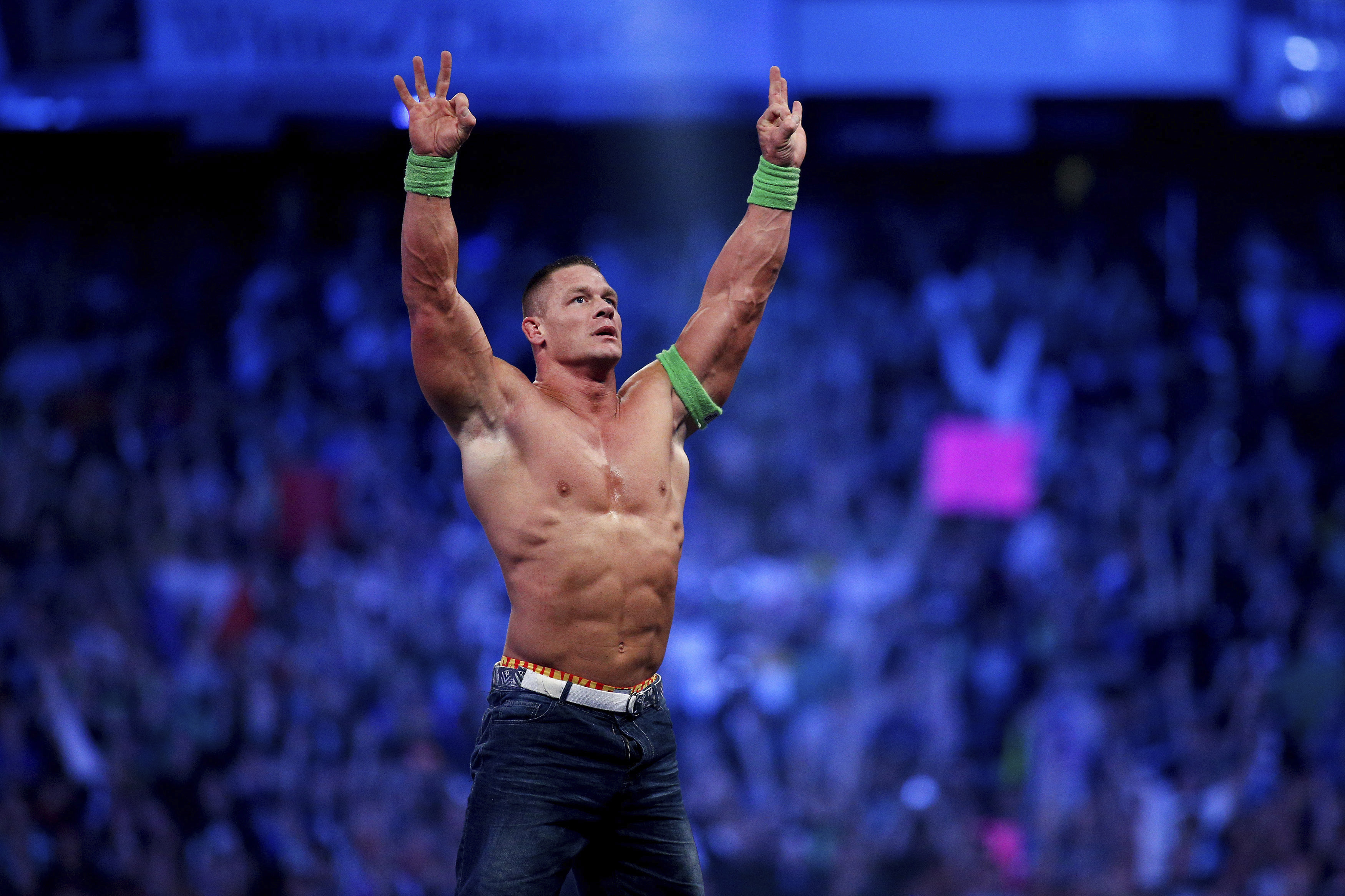 FILE- John Cena celebrates his win during Wrestlemania XXX in New Orleans on April 6, 2014. Cena has been revealed as this year's WWE 2K23 video game cover star. The wrestling game is out Tuesday, March 14, 2023. 