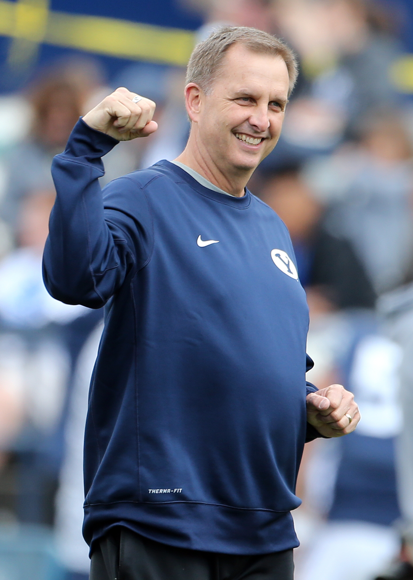 Brigham Young Cougars offensive coordinator Ty Detmer watches warmups before a spring football scrimmage at LaVell Edwards Stadium in Provo, on March 26, 2016.