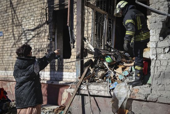 Ukrainian Emergency Service rescuers work on a building damaged by shelling in Kramatorsk, Donetsk region, Ukraine, Tuesday. One person has been killed, according to local authorities.