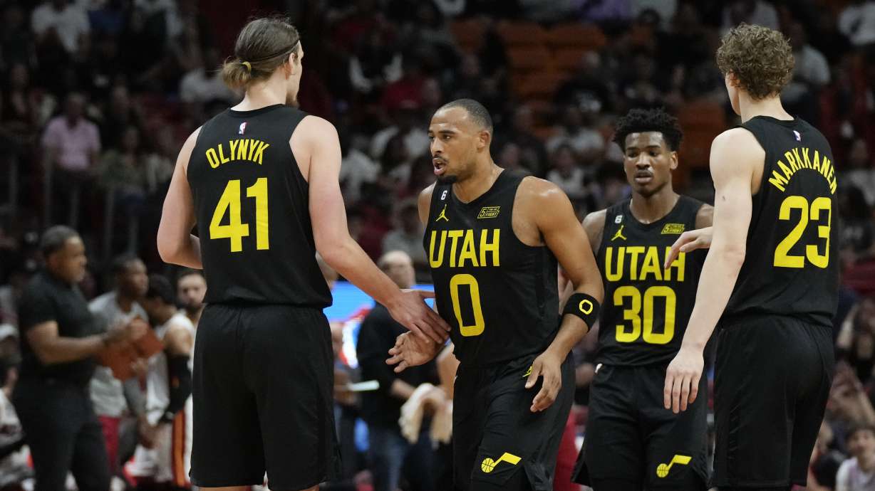 Utah Jazz guard Talen Horton-Tucker (0) celebrates with forward Kelly Olynyk (41), guard Ochai Agbaji (30) and forward Lauri Markkanen (23), during the first half of an NBA basketball game against the Miami Heat, Monday, March 13, 2023, in Miami.