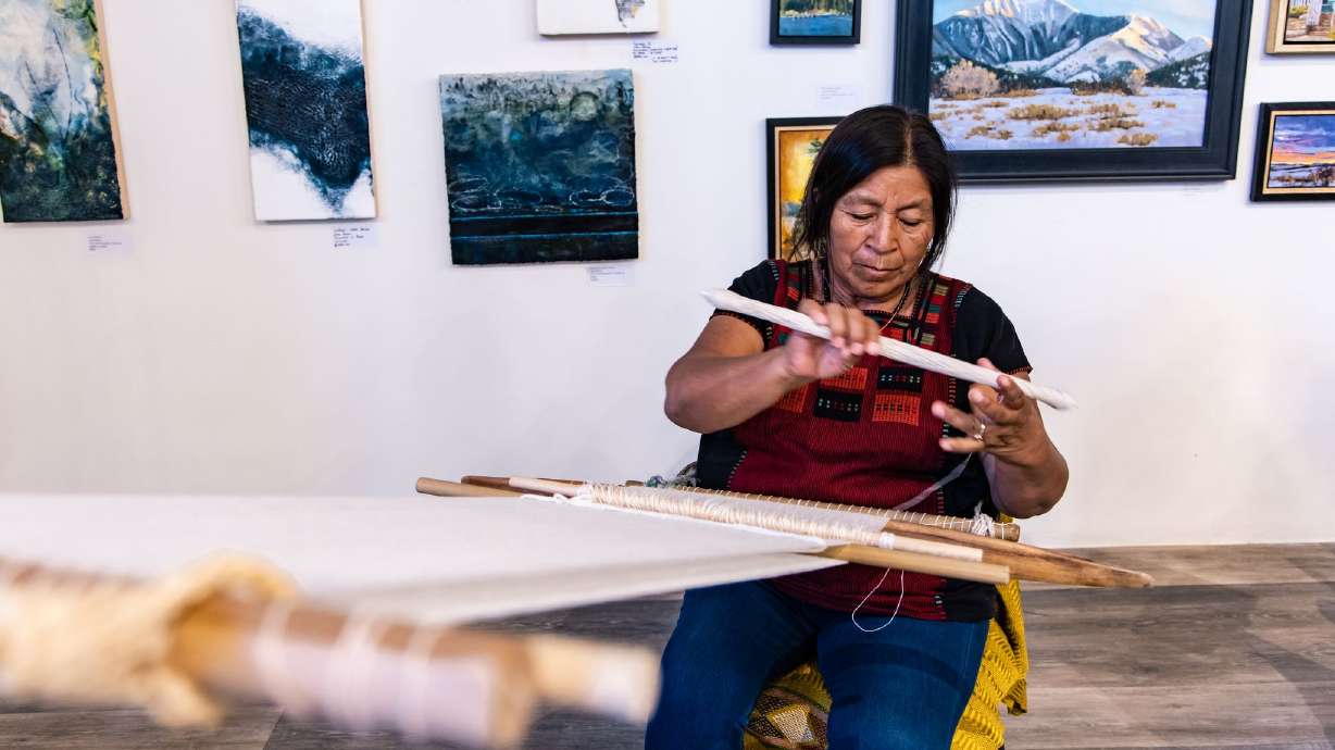 Maria Elena Lowe, who specializes in Mayan embroidery, works on a piece during the 2022 Latino Arts Festival in Park City.