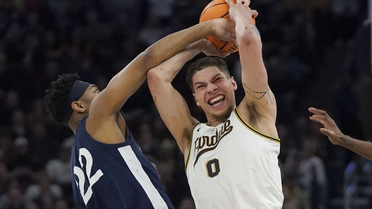 CORRECTS TO SUNDAY, MARCH 12, 2023, NOT SATURDAY, MARCH 11, 2023 - Penn State's Jalen Pickett (22) pressures Purdue's Mason Gillis during the second half of an NCAA college basketball championship game at the Big Ten men's tournament, Sunday, March 12, 2023, in Chicago.