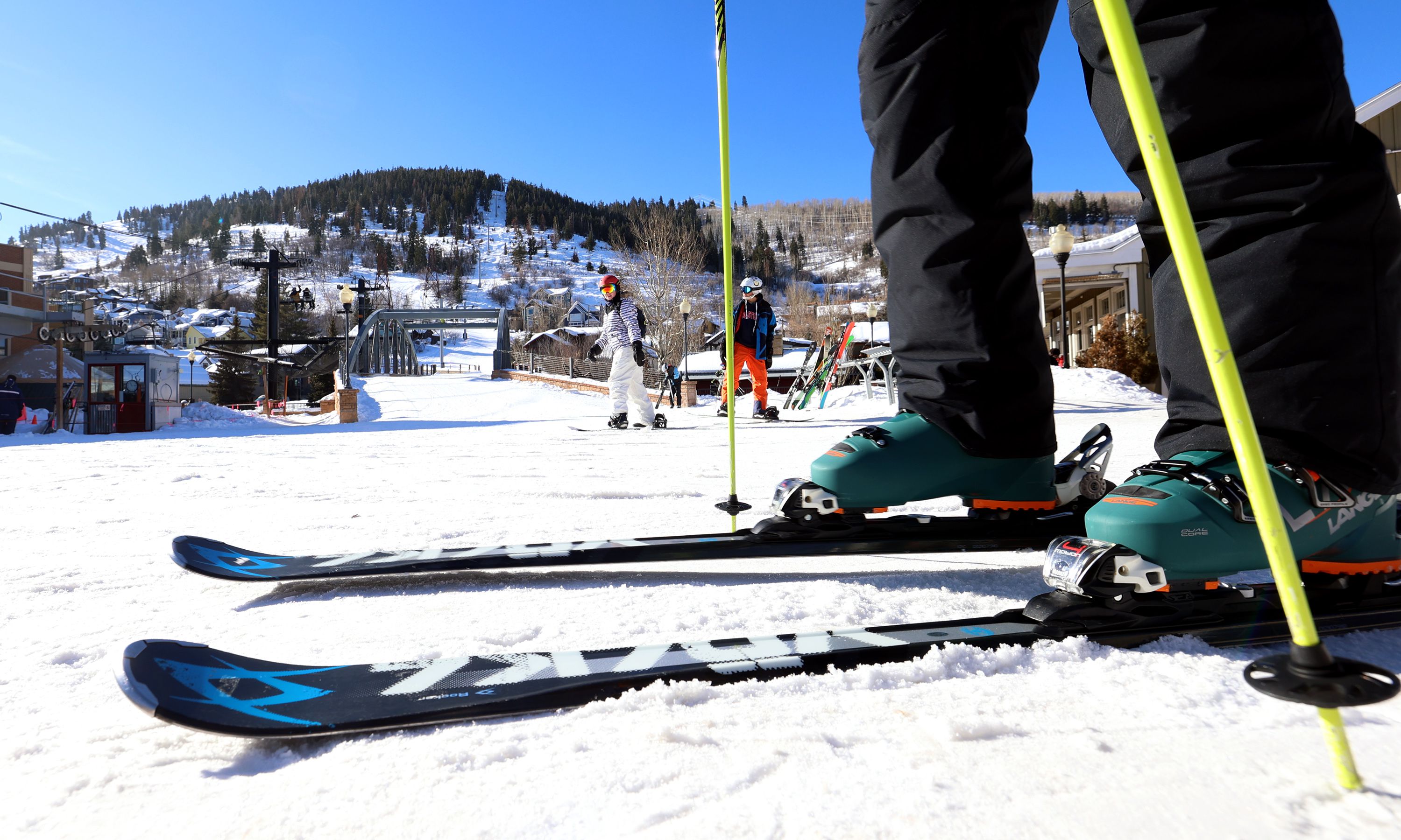 Skiers and snowboarders move to get on a lift in Park City on Jan. 11, 2022. Officials enacted a drinking water regulation that prohibits using or selling a ski wax they believe is causing contamination of groundwater wells and an aquifer.