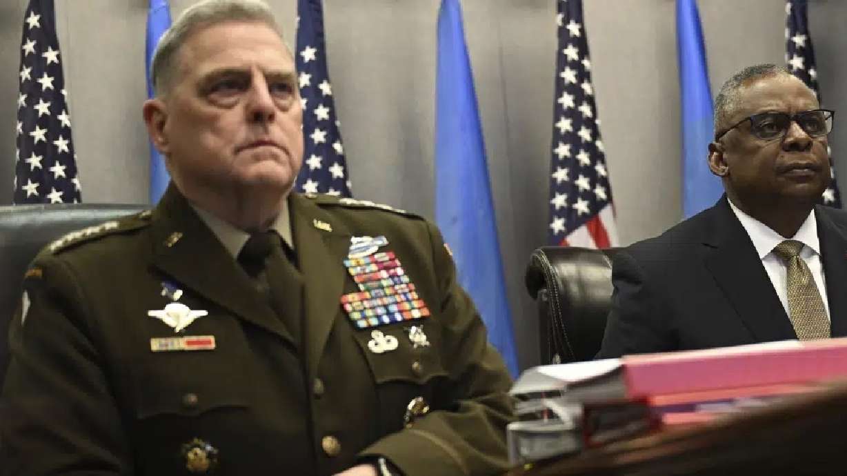 Defense Secretary Lloyd Austin, right, and Chairman of the Joint Chiefs of Staff Gen. Mark Milley, attend a virtual meeting of the Ukraine Defense Contact Group, Wednesday at the Pentagon in Washington. Russian authorities say that they will try to recover the fragments of a U.S. surveillance drone that American forces brought down in the Black Sea