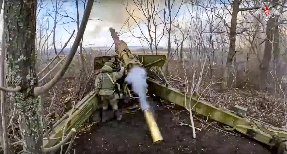 The Russian army's 152-mm howitzer "Hyacinth-B" fires at Ukrainian troops at an undisclosed location, seen in a photo distributed Wednesday.