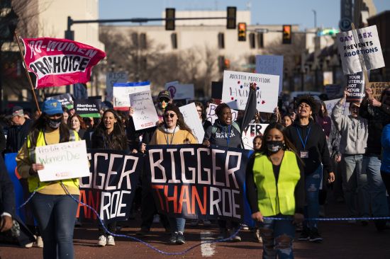 People march through downtown Amarillo to protest a lawsuit to ban the abortion drug mifepristone on Feb. 11,  in Amarillo, Texas. A federal judge will hear arguments Wednesday in a high-stakes court case that could threaten access to abortion medication and blunt the authority of U.S. drug regulators.