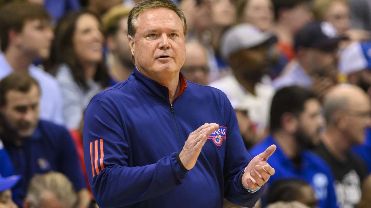Kansas head coach Bill Self applauds his team's play against Texas Tech during the first half of an NCAA college basketball game in Lawrence, Kan., Tuesday, Feb. 28, 2023.
