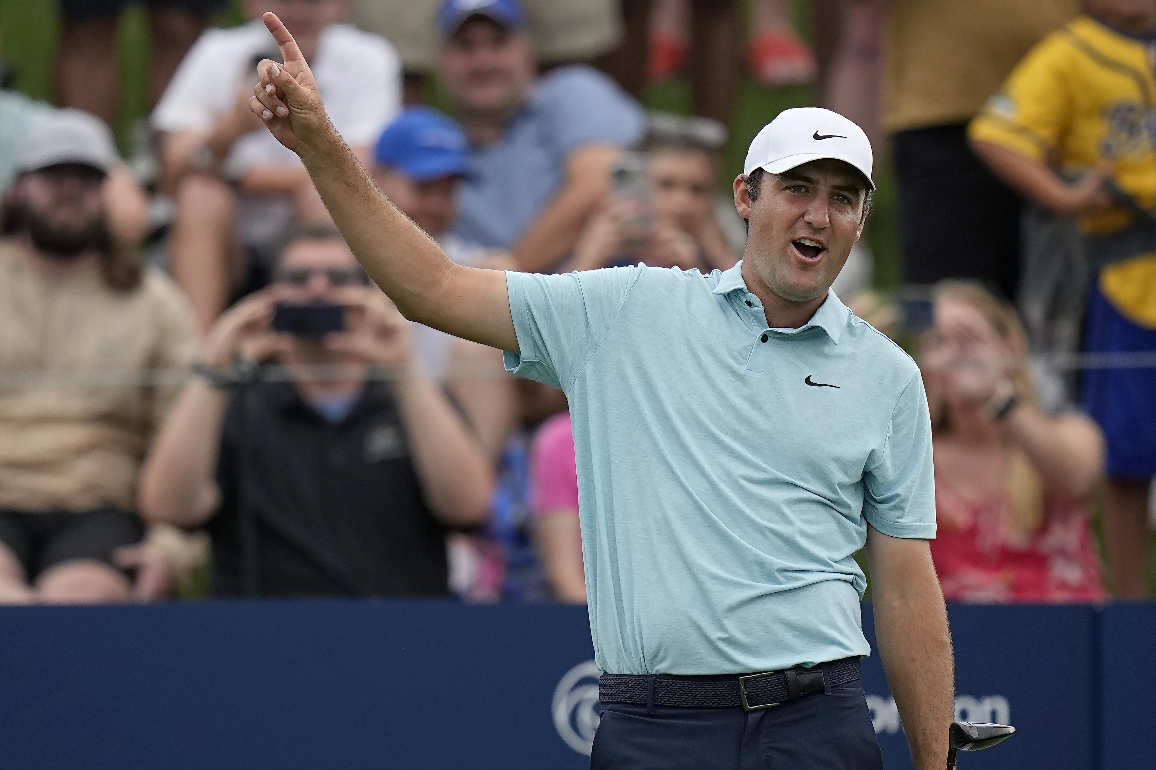 Scottie Scheffler watches his shot from the 18th tee during the final round of The Players Championship golf tournament, Sunday, March 12, 2023, in Ponte Vedra Beach, Fla. 