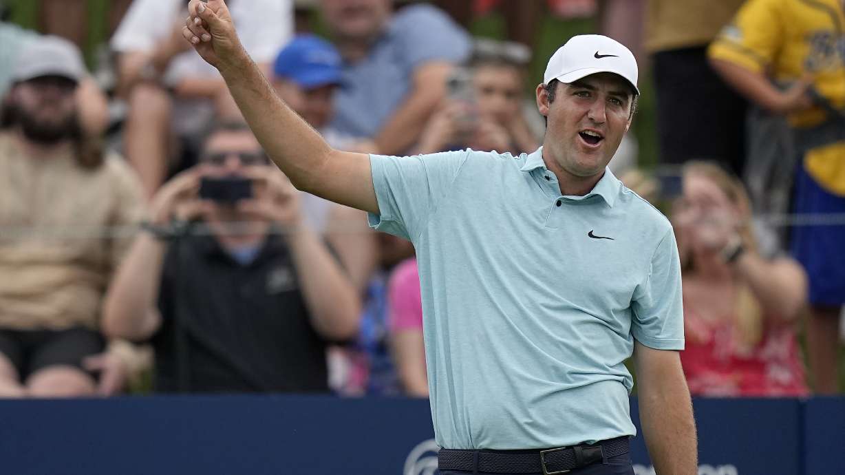 Scottie Scheffler watches his shot from the 18th tee during the final round of The Players Championship golf tournament, Sunday, March 12, 2023, in Ponte Vedra Beach, Fla.