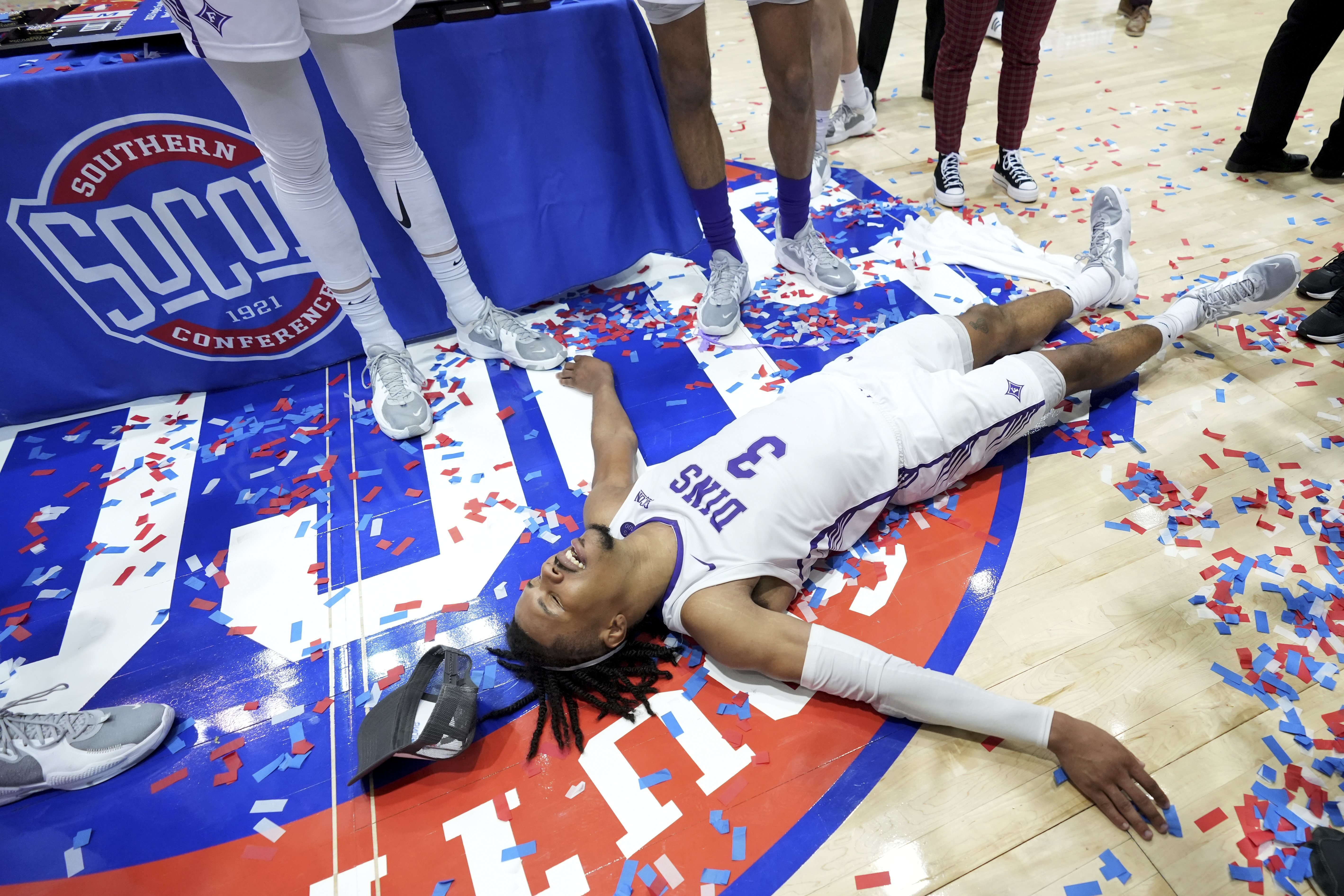 Furman guard Mike Bothwell celebrates his team's win over Chattanooga for the NCAA men's college basketball championship game for the Southern Conference tournament, Monday, March 6, 2023, in Asheville, N.C. 