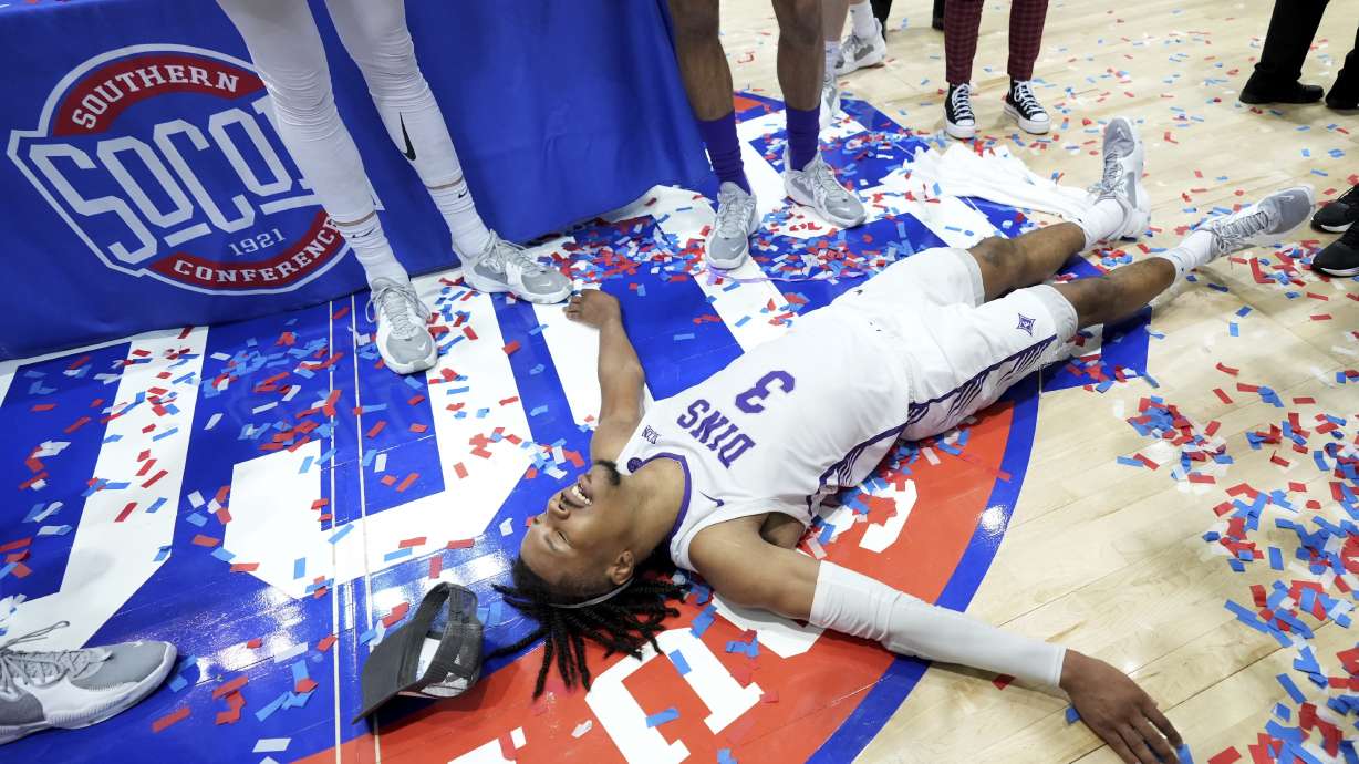 Furman guard Mike Bothwell celebrates his team's win over Chattanooga for the NCAA men's college basketball championship game for the Southern Conference tournament, Monday, March 6, 2023, in Asheville, N.C.