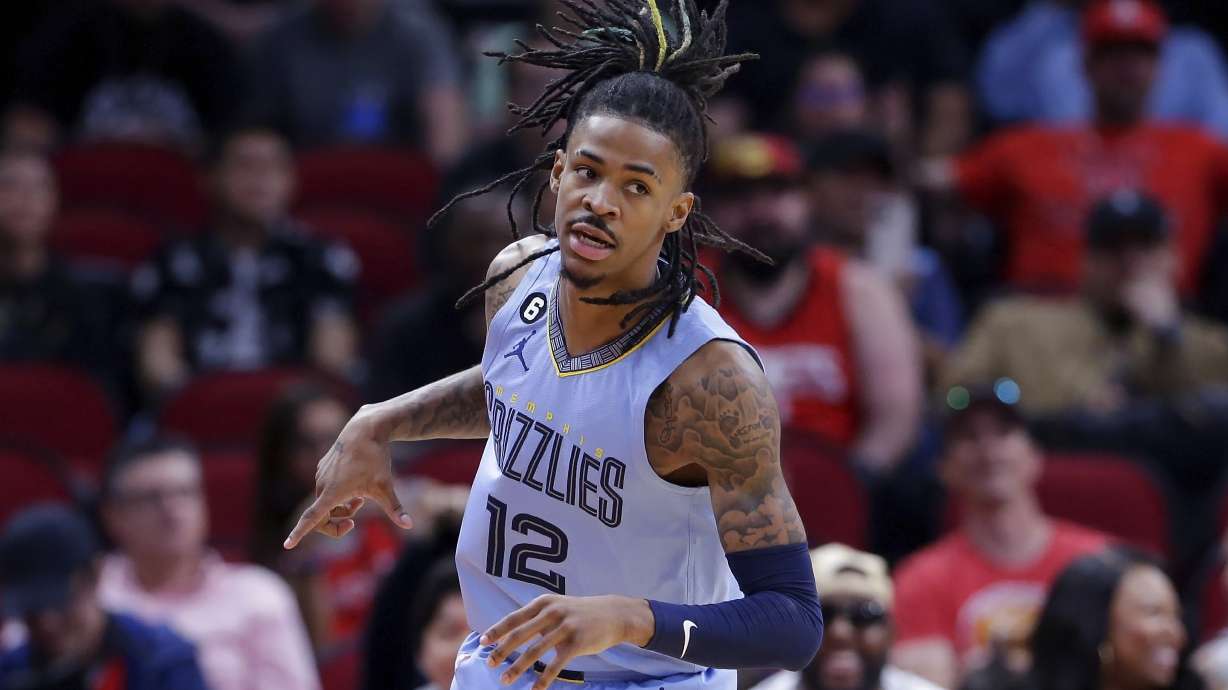FILE - Memphis Grizzlies guard Ja Morant reacts after sinking a three point shot against the Houston Rockets during the first half of an NBA basketball game Wednesday, March 1, 2023, in Houston. That aggressive style of play helped skyrocket the 23-year-old guard to a meteoric rise to NBA stardom. But his aggressive approach to basketball seemingly has spilled over into his off-court lifestyle putting him on the sidelines.